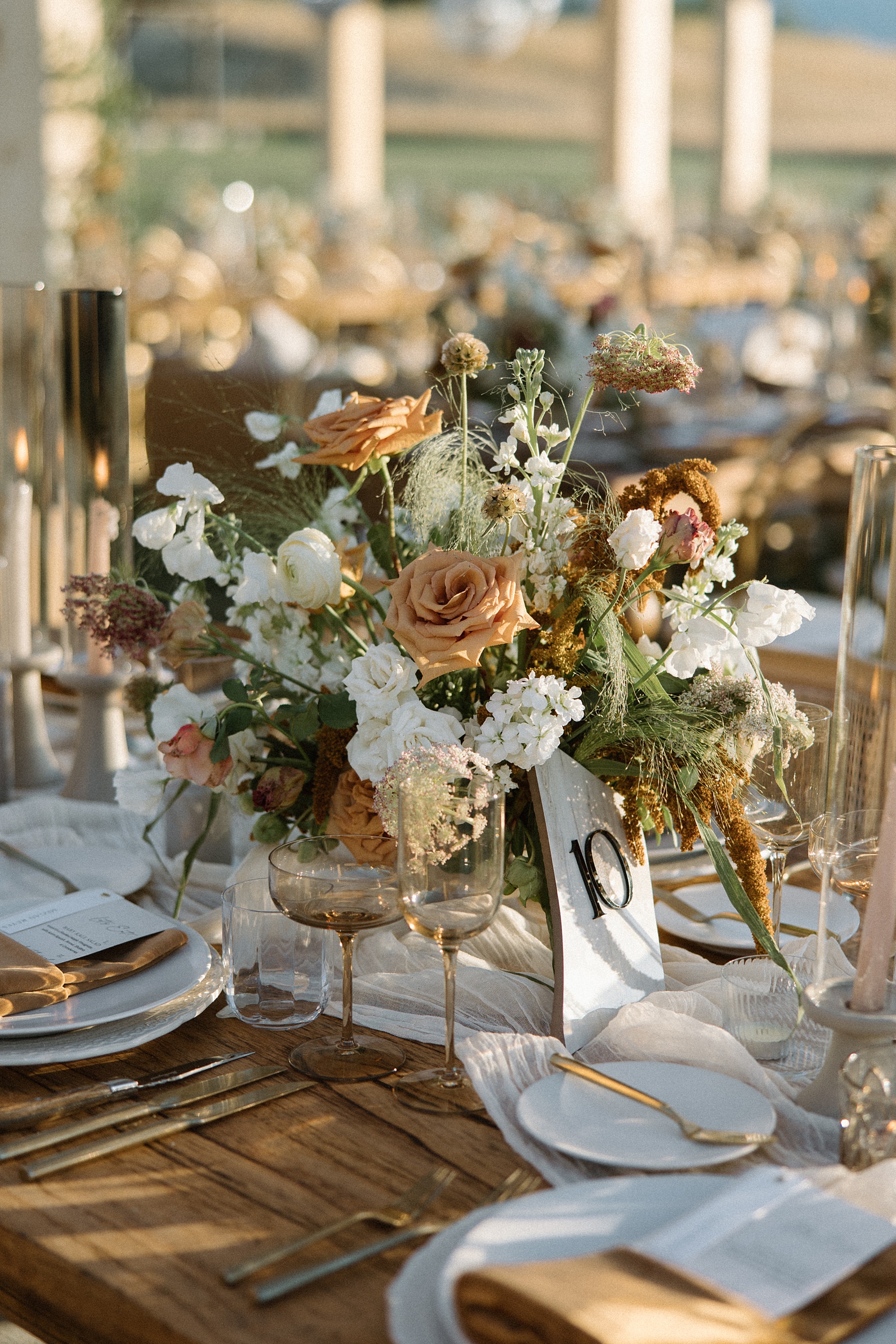 elegant wedding tablescape with stone table numbers 