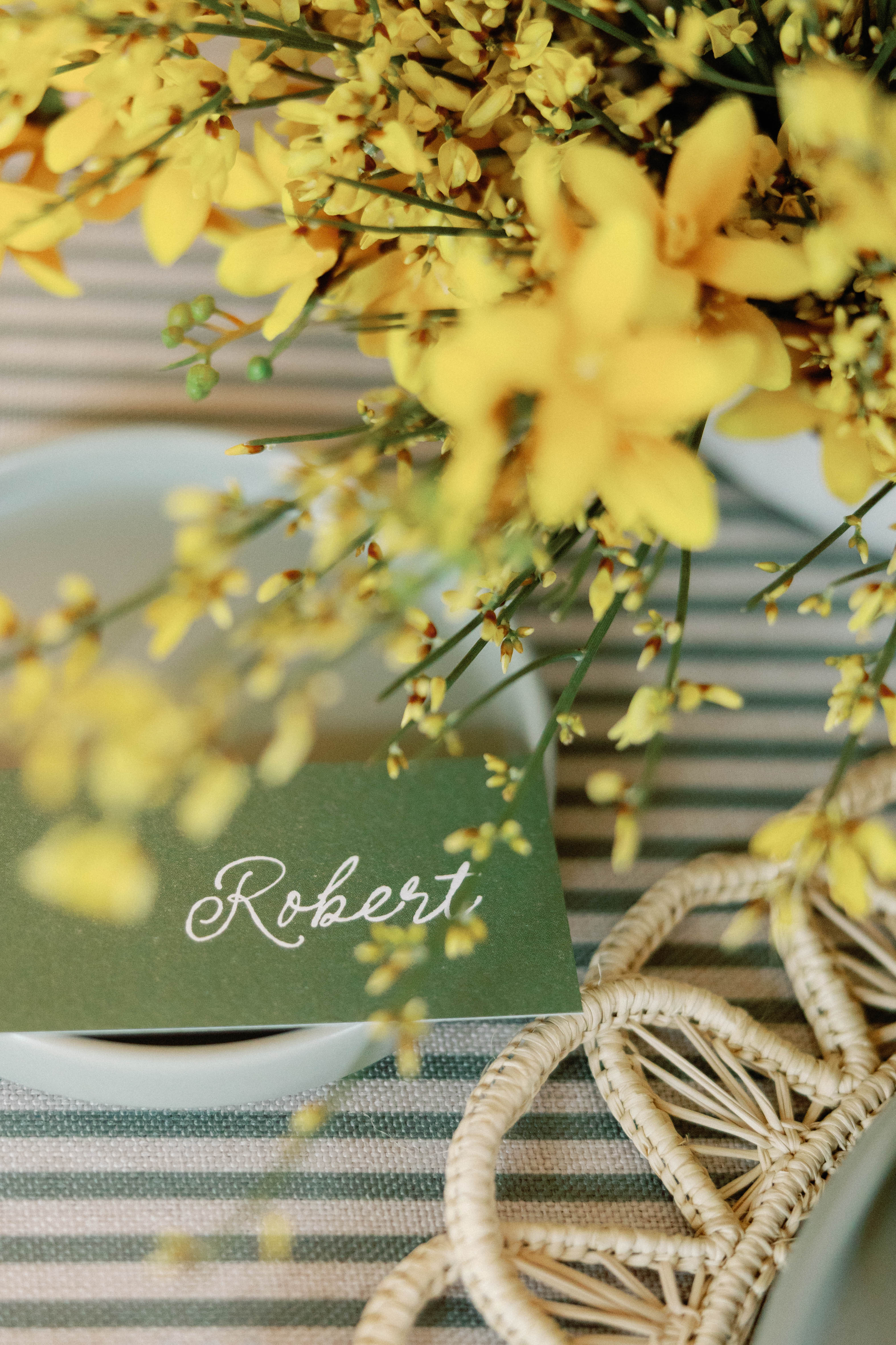 dark green place cards with white calligraphy 
