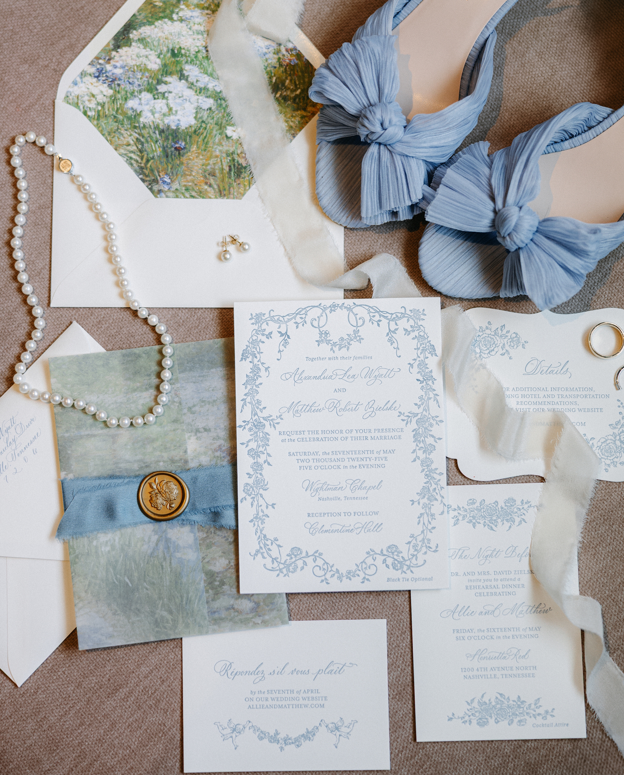 Letter pressed invitation suite with custom details like floral landscape envelope liner and vellum overlay with wax seal 