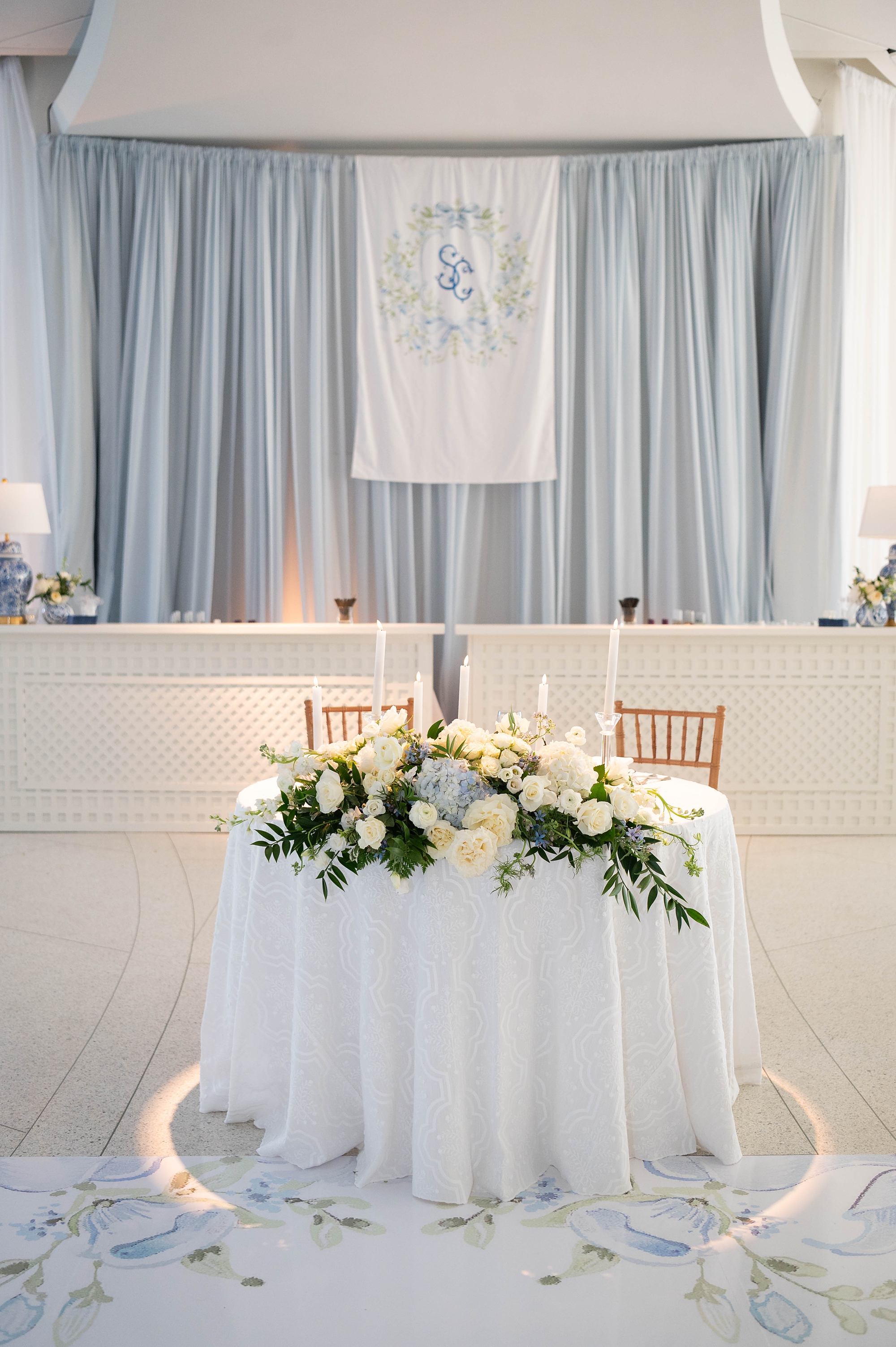 fabric sign at reception featuring the custom monogram design by White Ink Calligraphy