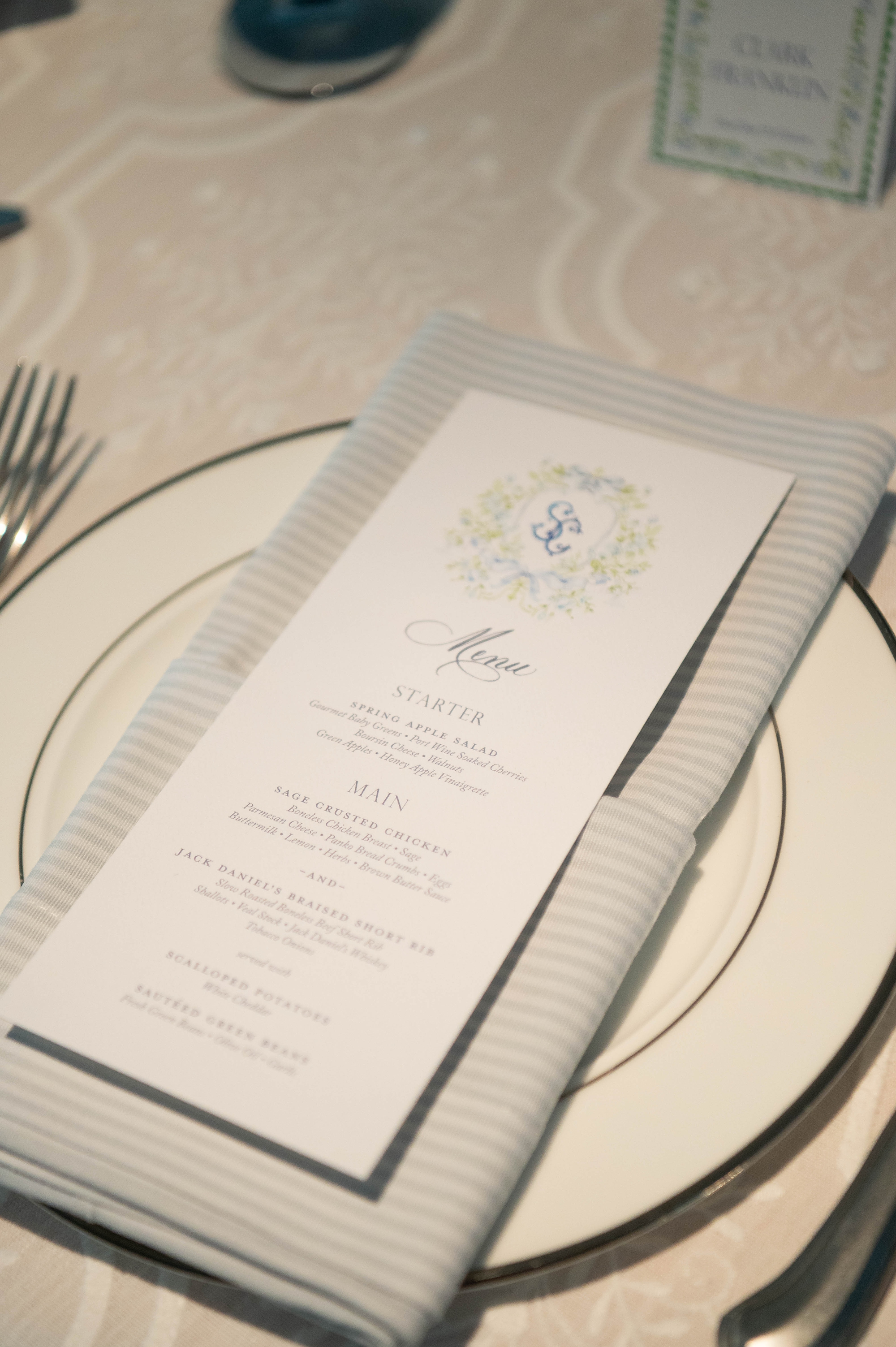 wedding menus sitting on folded napkin