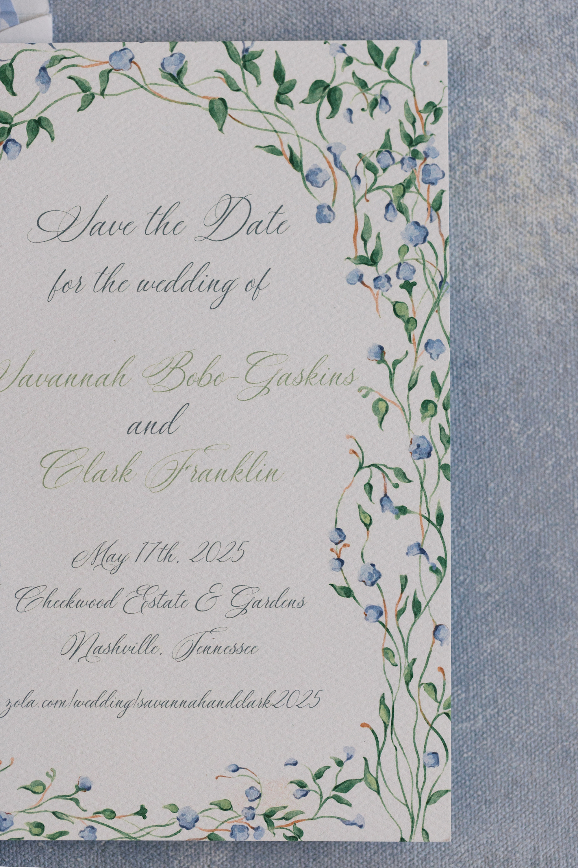 Save the date with green vine and blue flower border