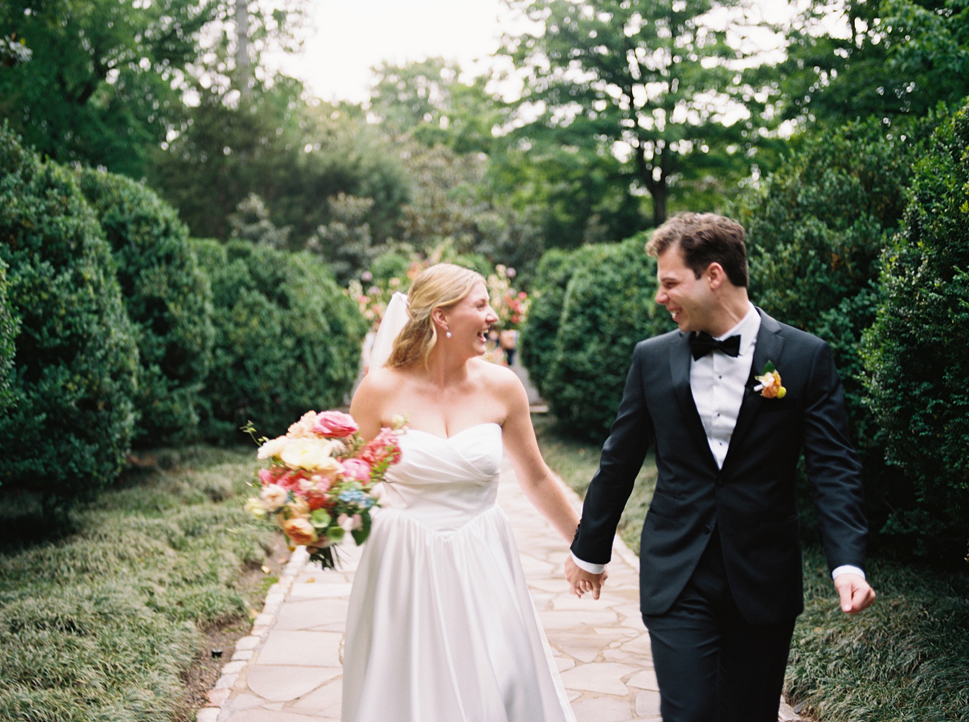 Newlyweds walking together at Artistic and Colorful Wedding at Belle Meade in Nashville  