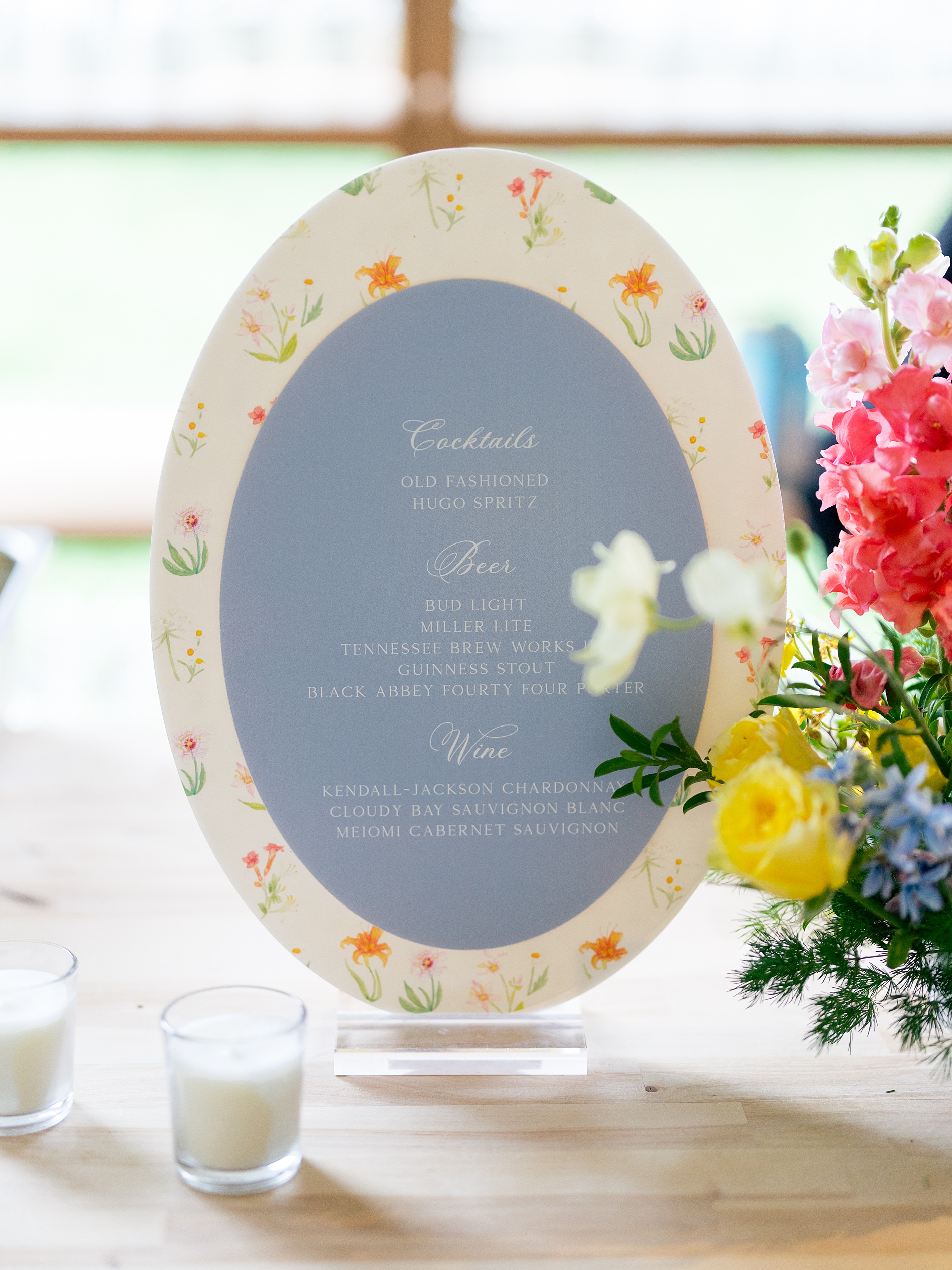 custom bar sign with floral border that matches wedding invitation suite