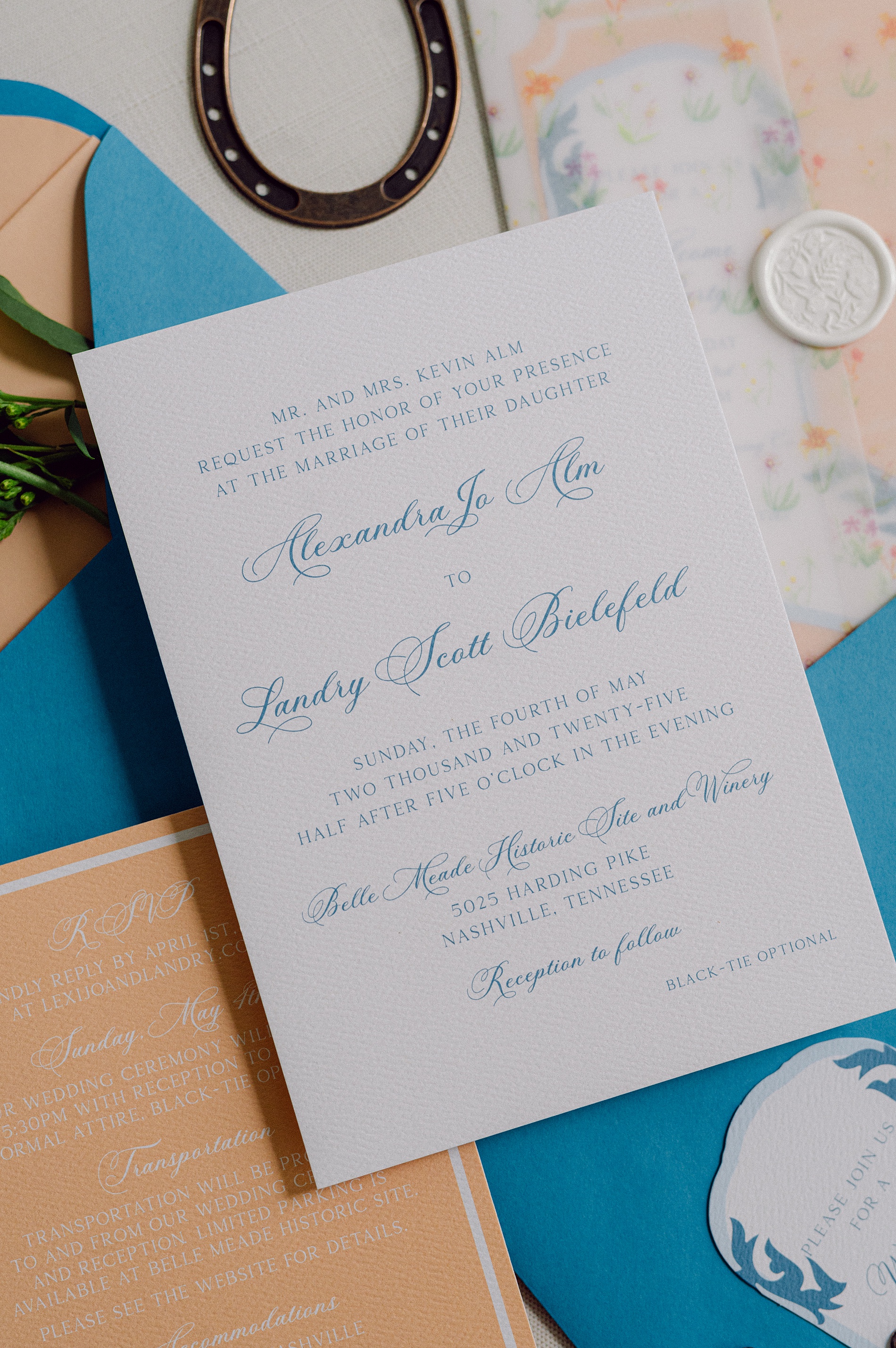 blue calligraphy on white invite