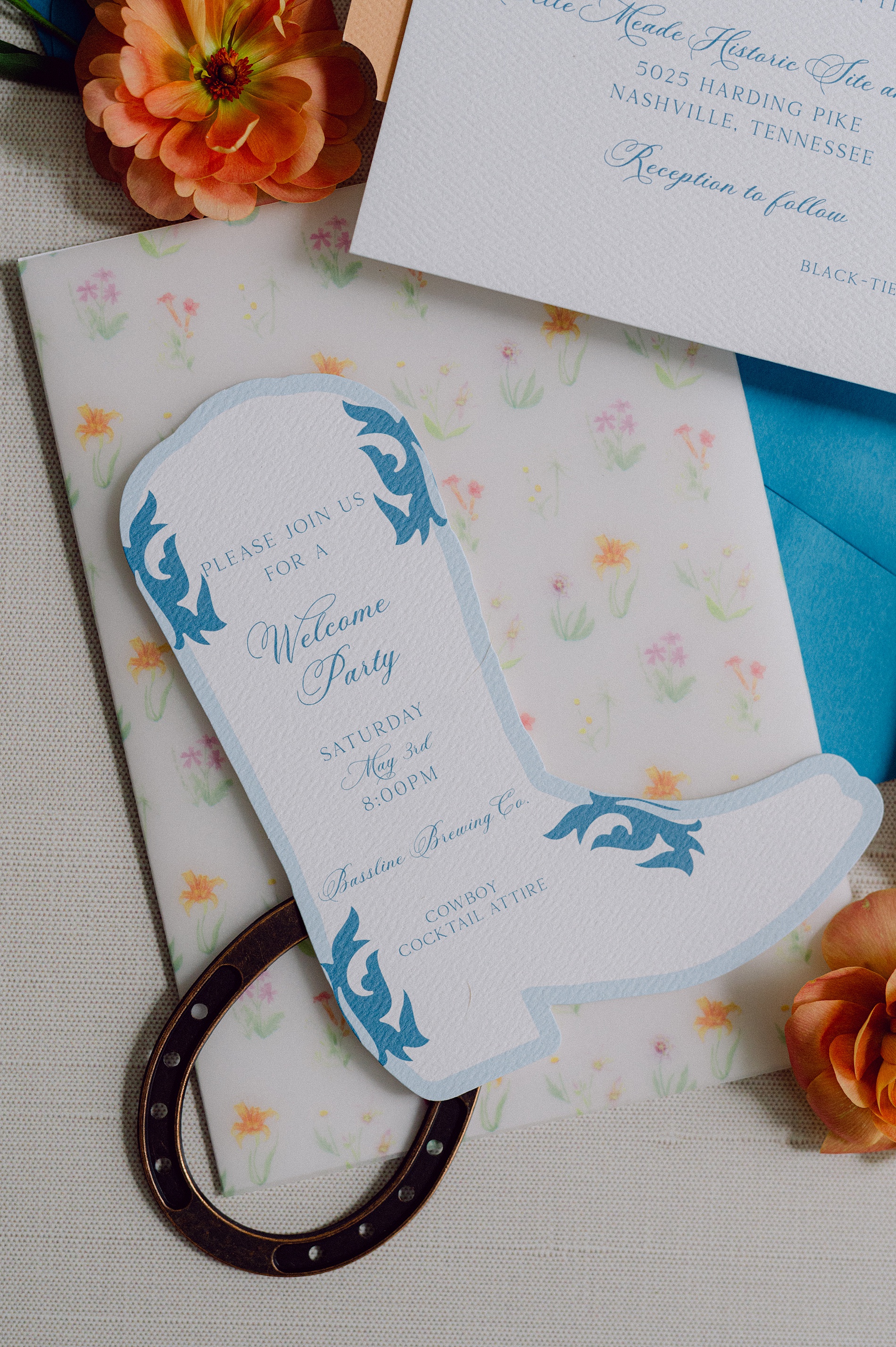 cowboy shaped welcome party invitation and hand painted floral design on vellum overlay 