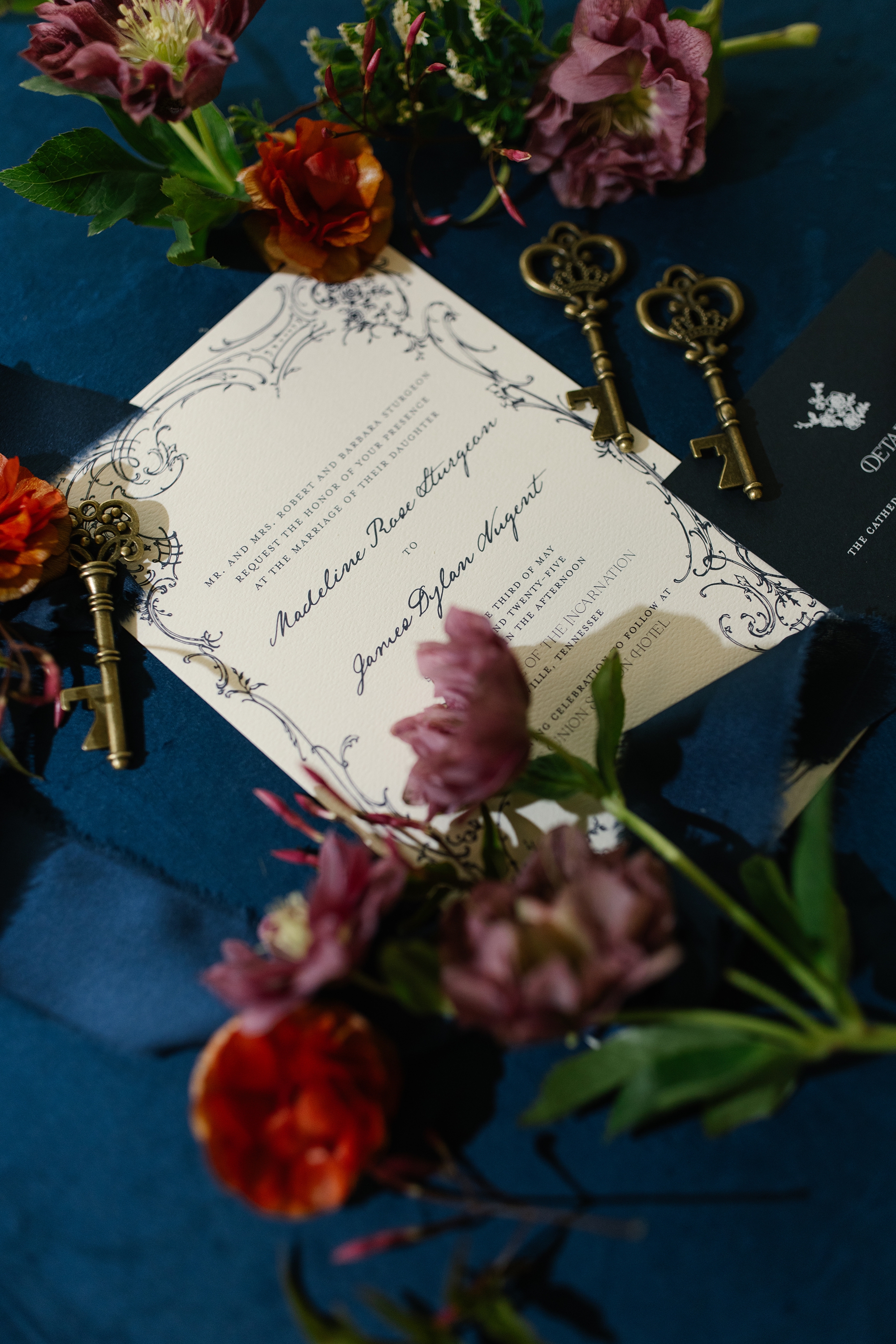 white wedding invitation with ornate border 