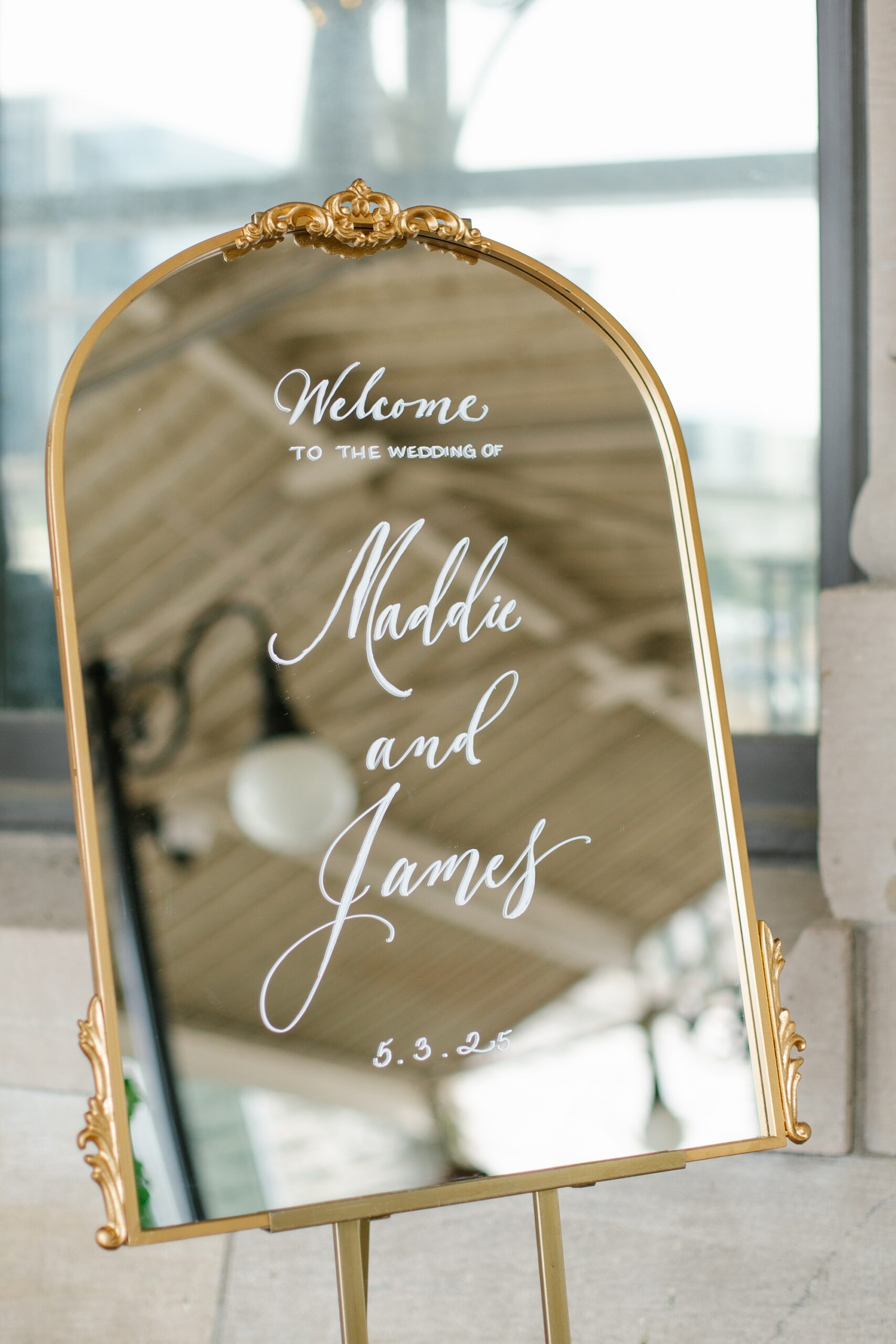 mirrored wedding welcome sign with white lettering 