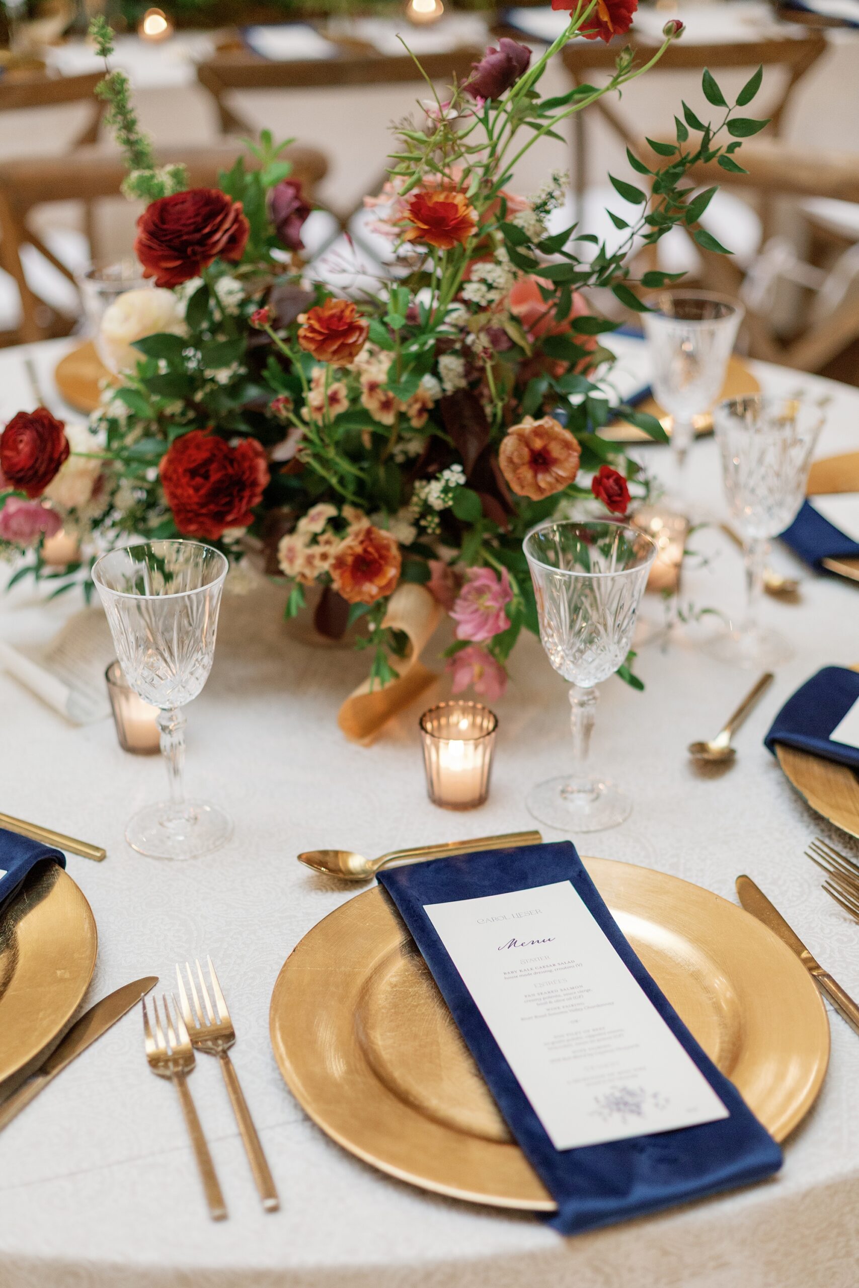 wedding menus on gold plates on tables at wedding reception in Nashville