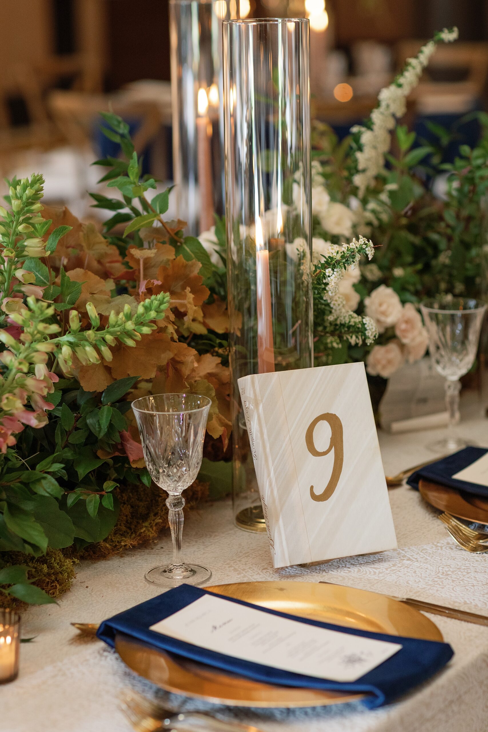 vintage books hand painted with table number in gold 