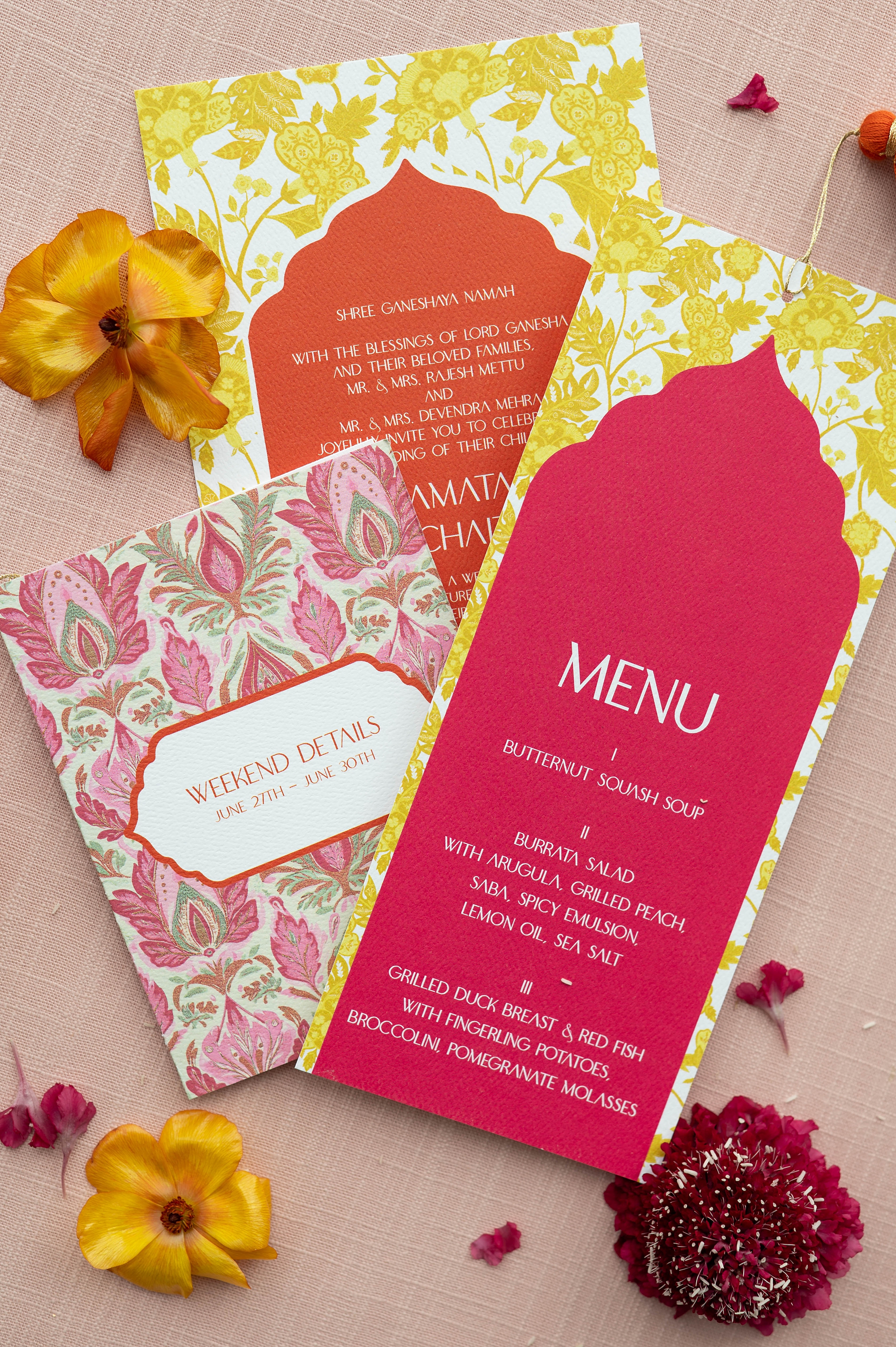 Vibrant Hindu Wedding invitation suite with bold pink and bright yellow and orange colors. 