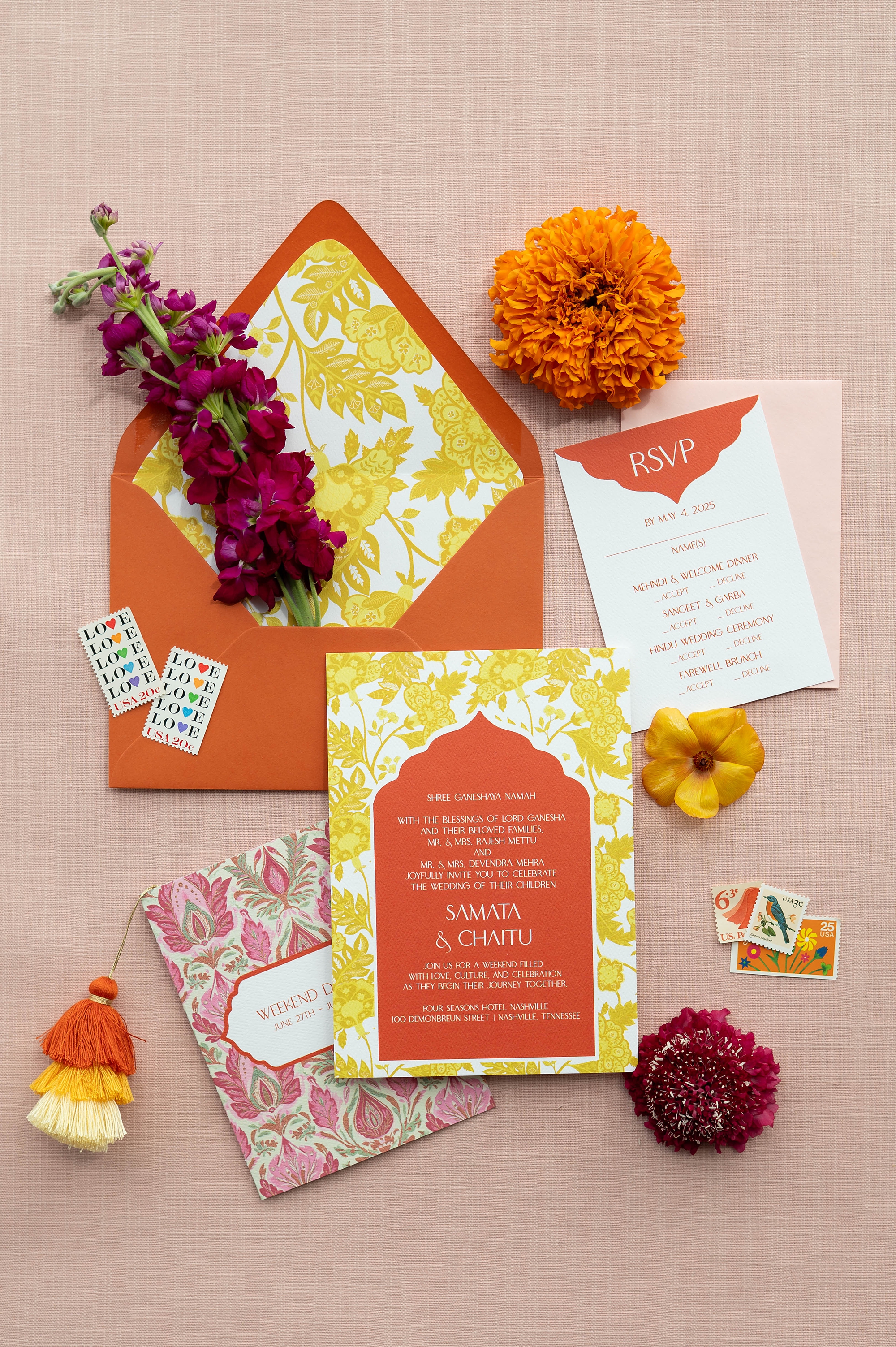 orange envelope with yellow pattern liner and an invitation in same colors