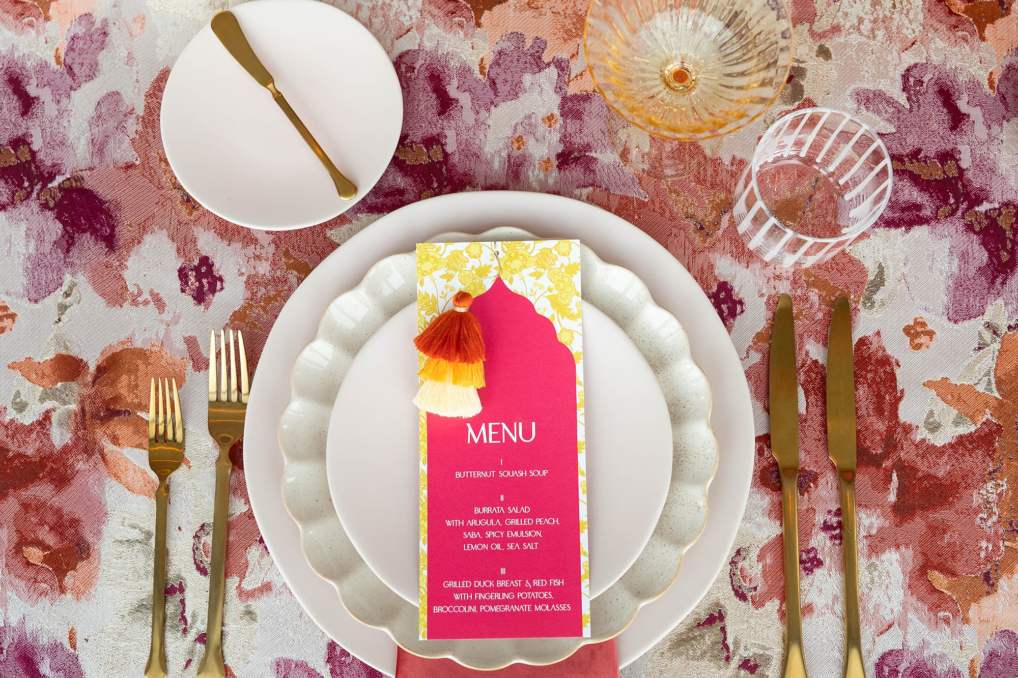 colorful wedding dinner menus on white plates 