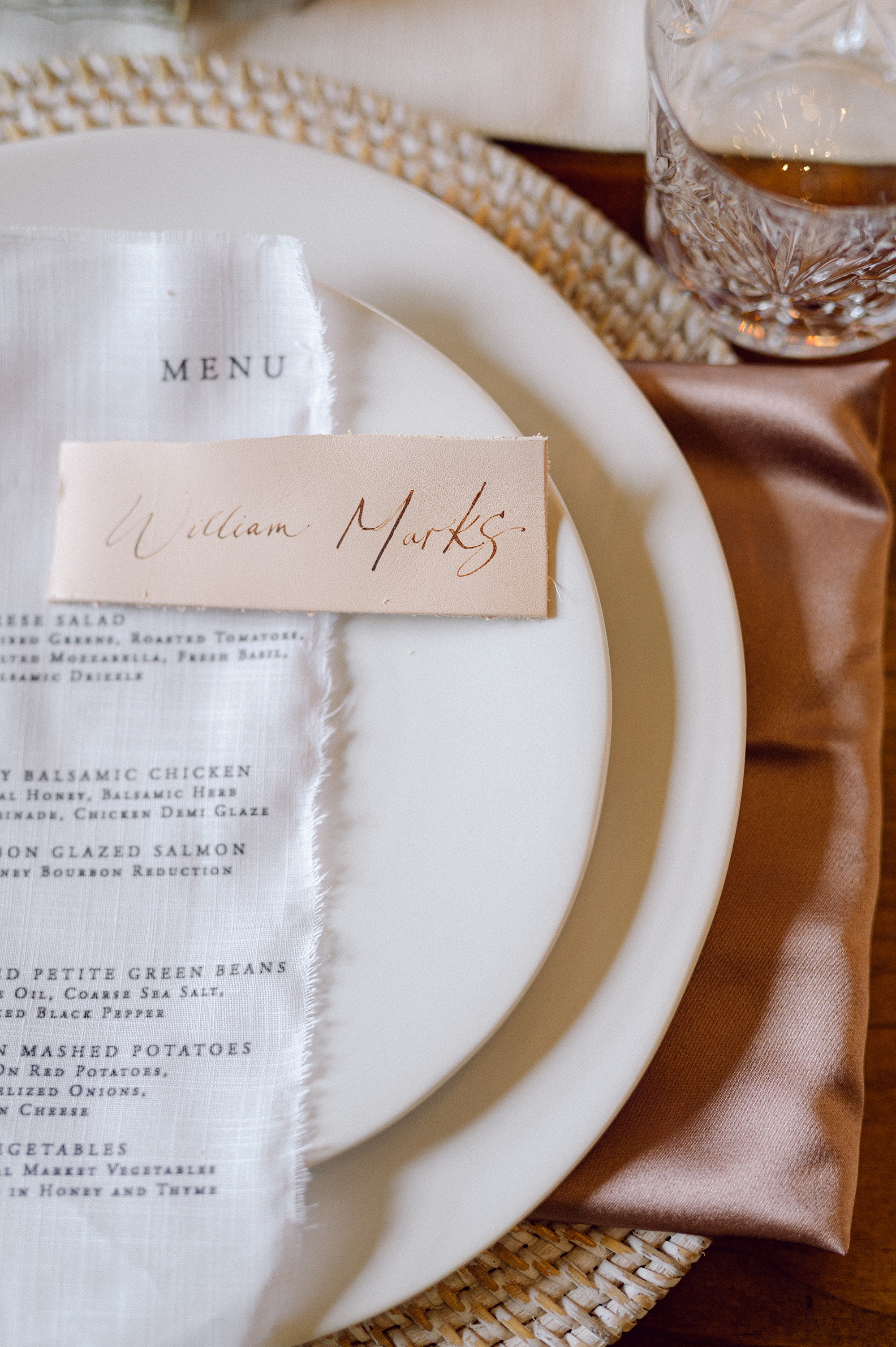 leather place cards engraved with guest names 