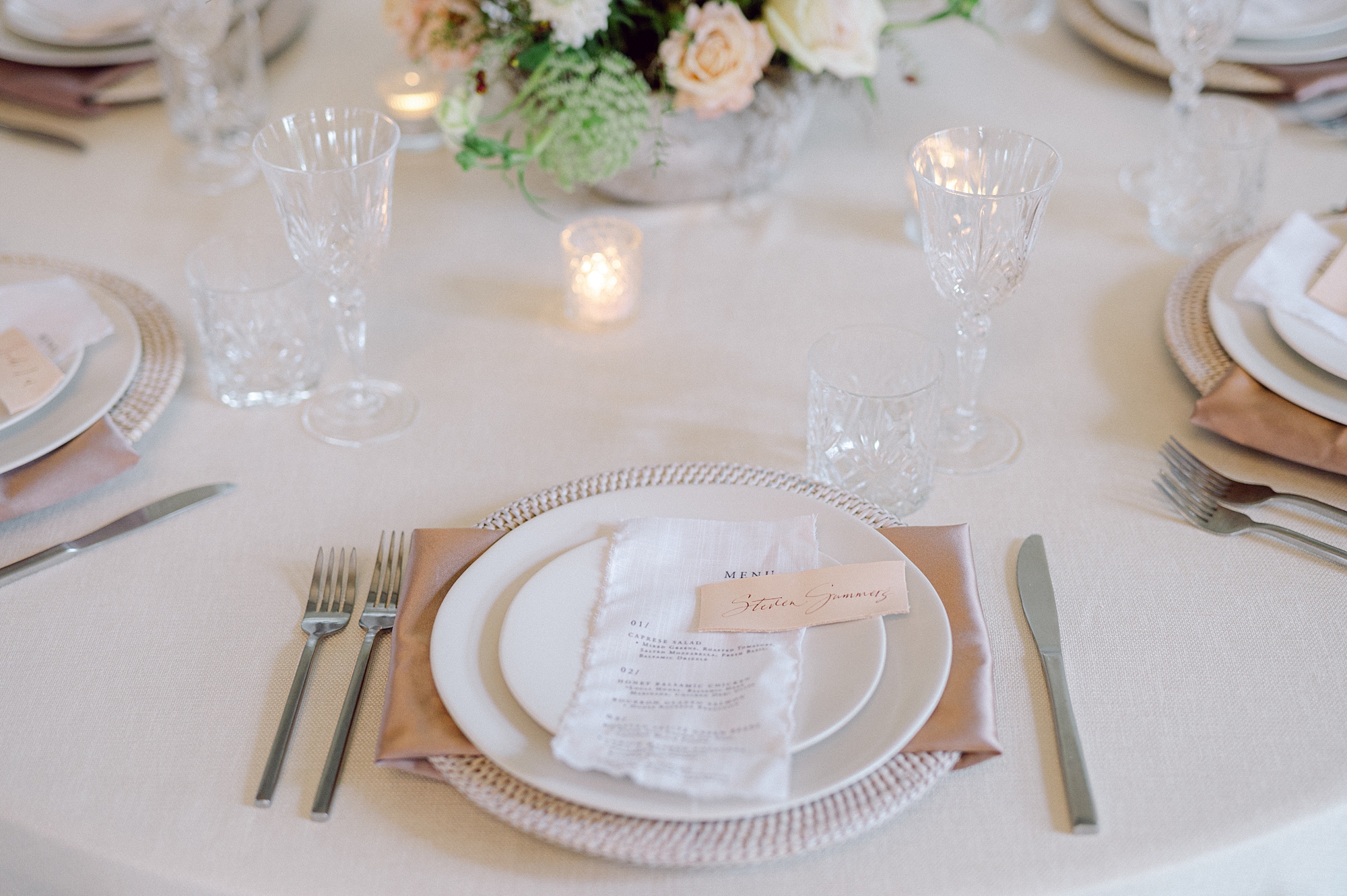 fabric menus and leather place cards   at place setting 