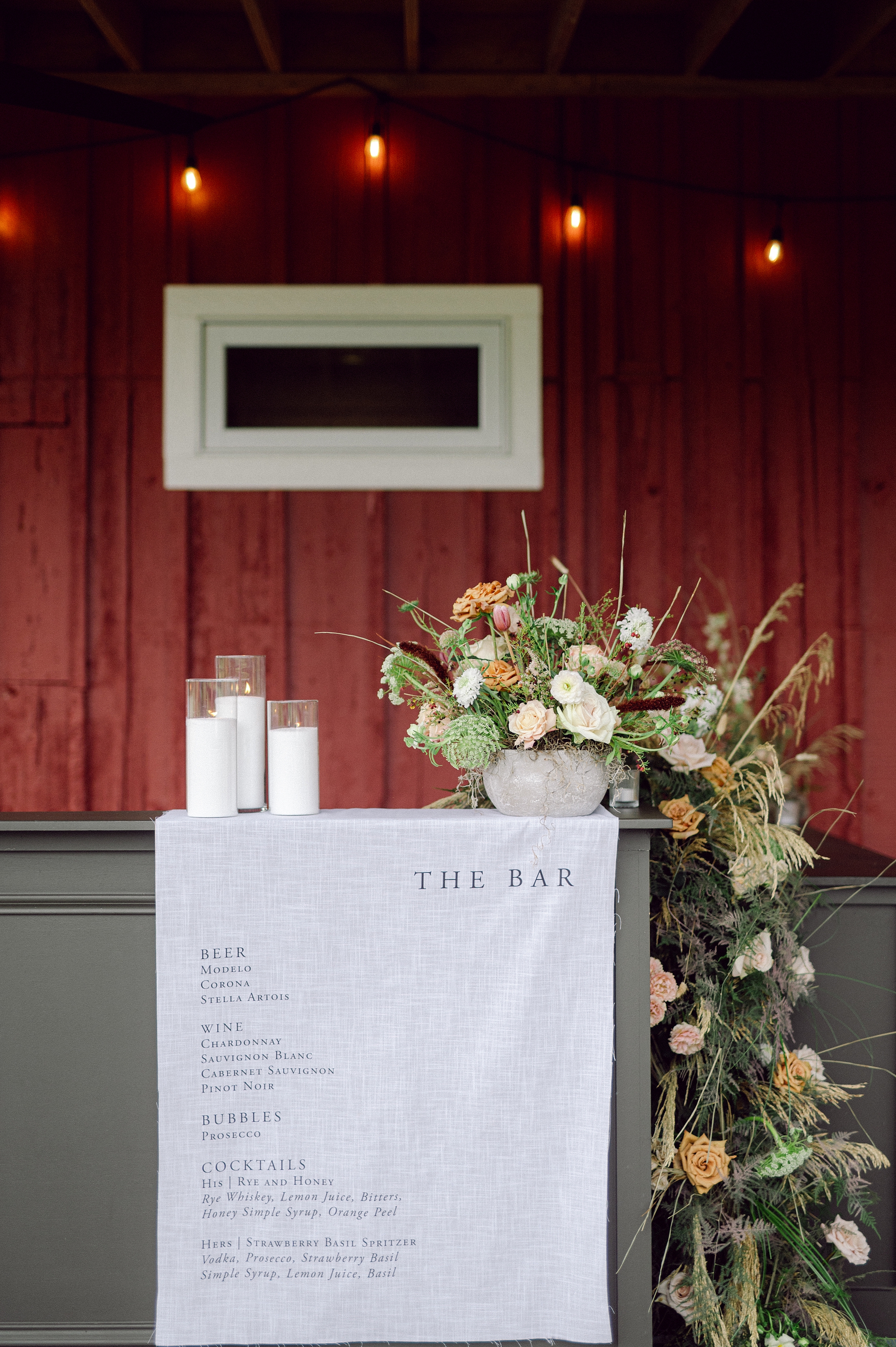 Cedarmont Farm Textured wedding details | Fabric bar sign with organic florals on top 