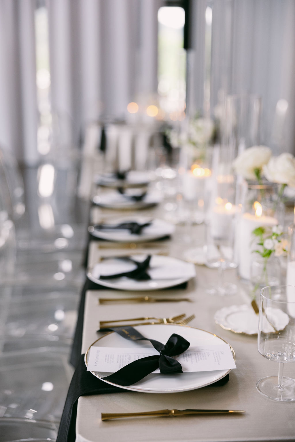 white menus and black satin ribbon place card 