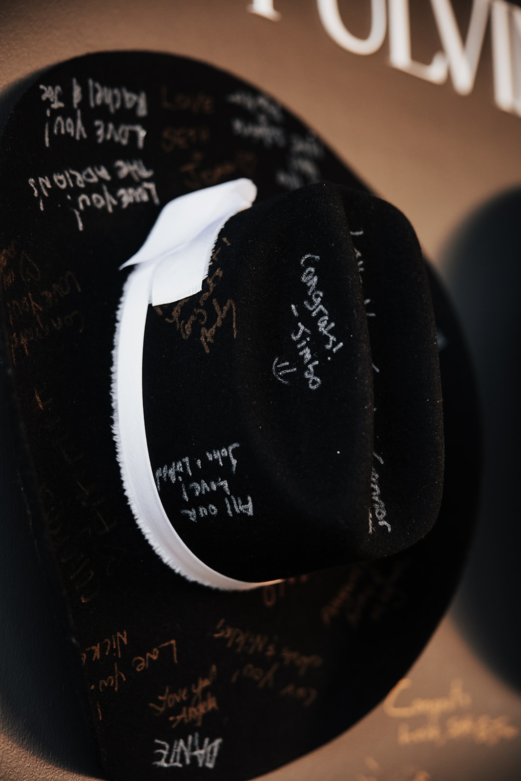 black cowboy hat with guest signatures 
