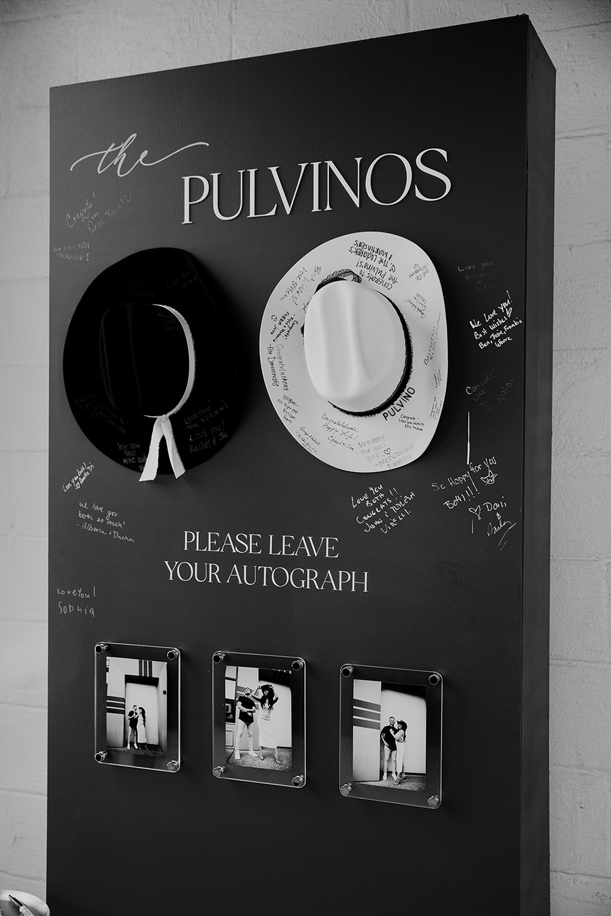 guests sign wall and cowboy hats for guestbook 