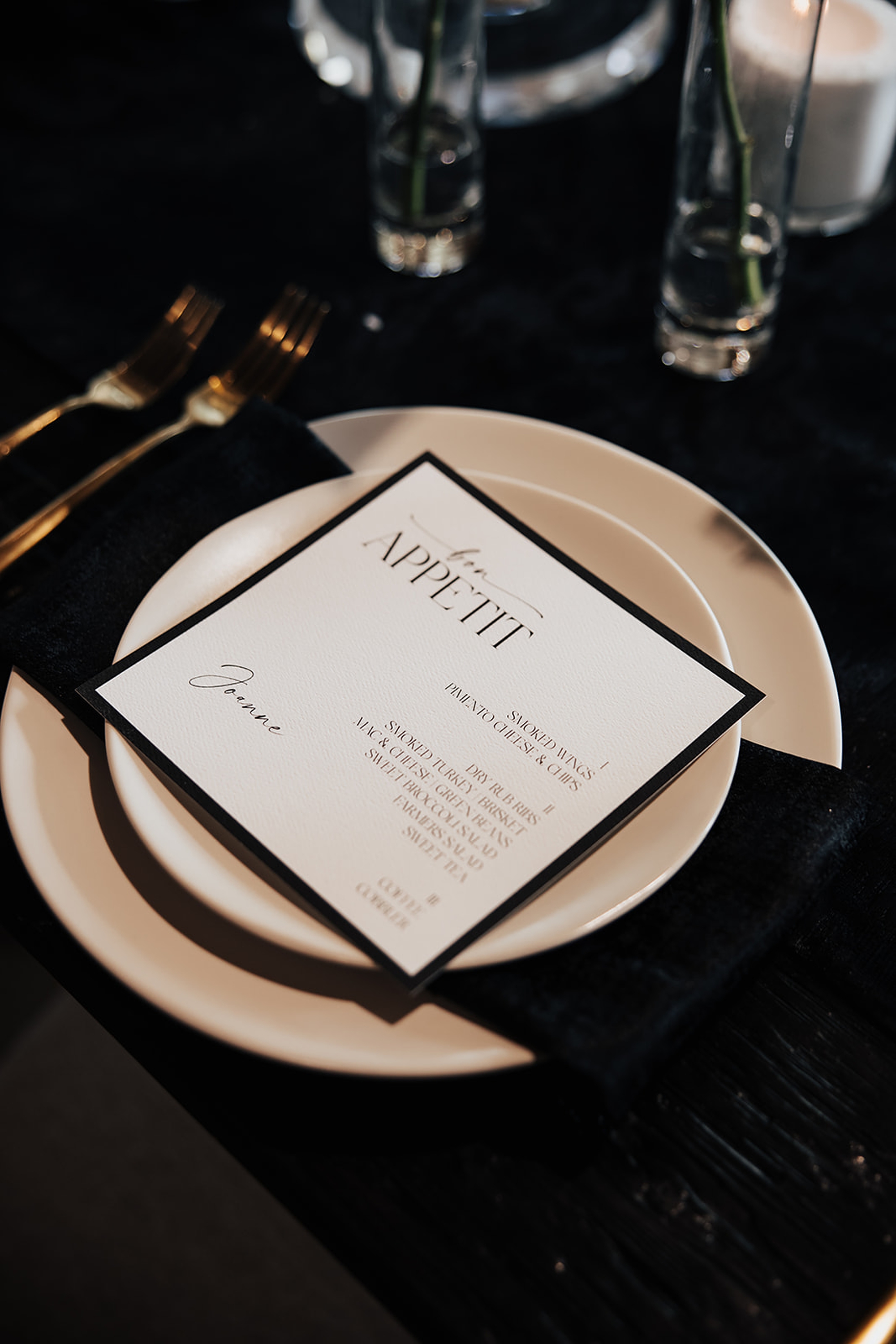 white menus framed on black paper 