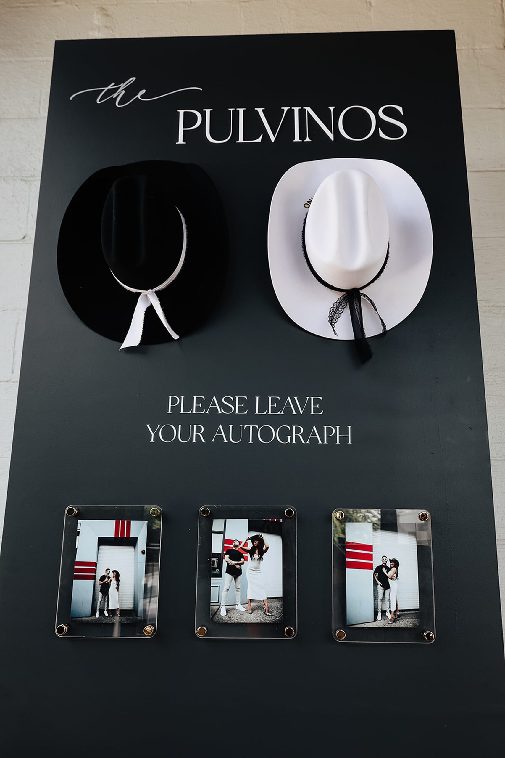 two cowboy hats hand on display for interactive guestbook 