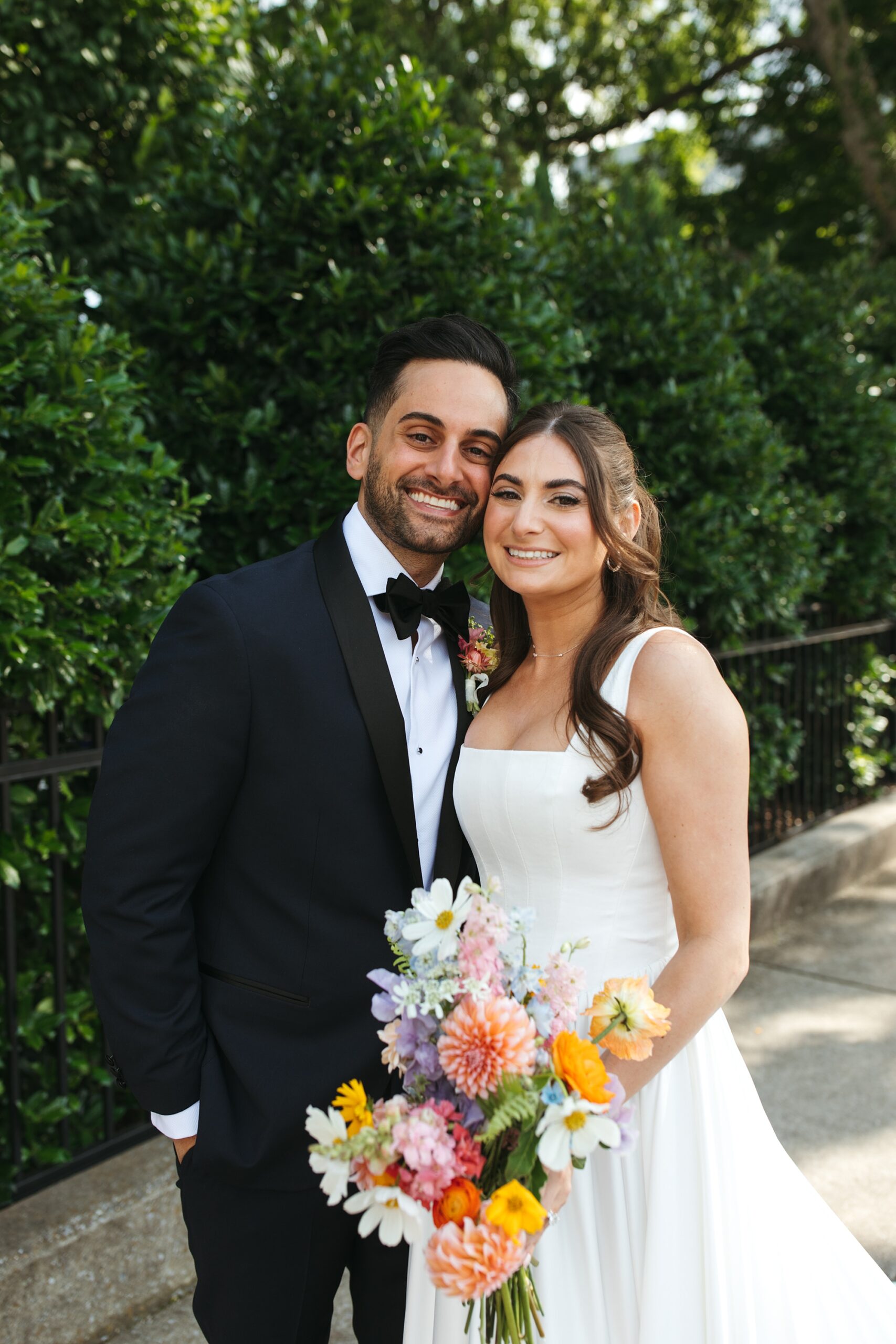 newlyweds from Nashville wedding featuring vinyl record wedding details 