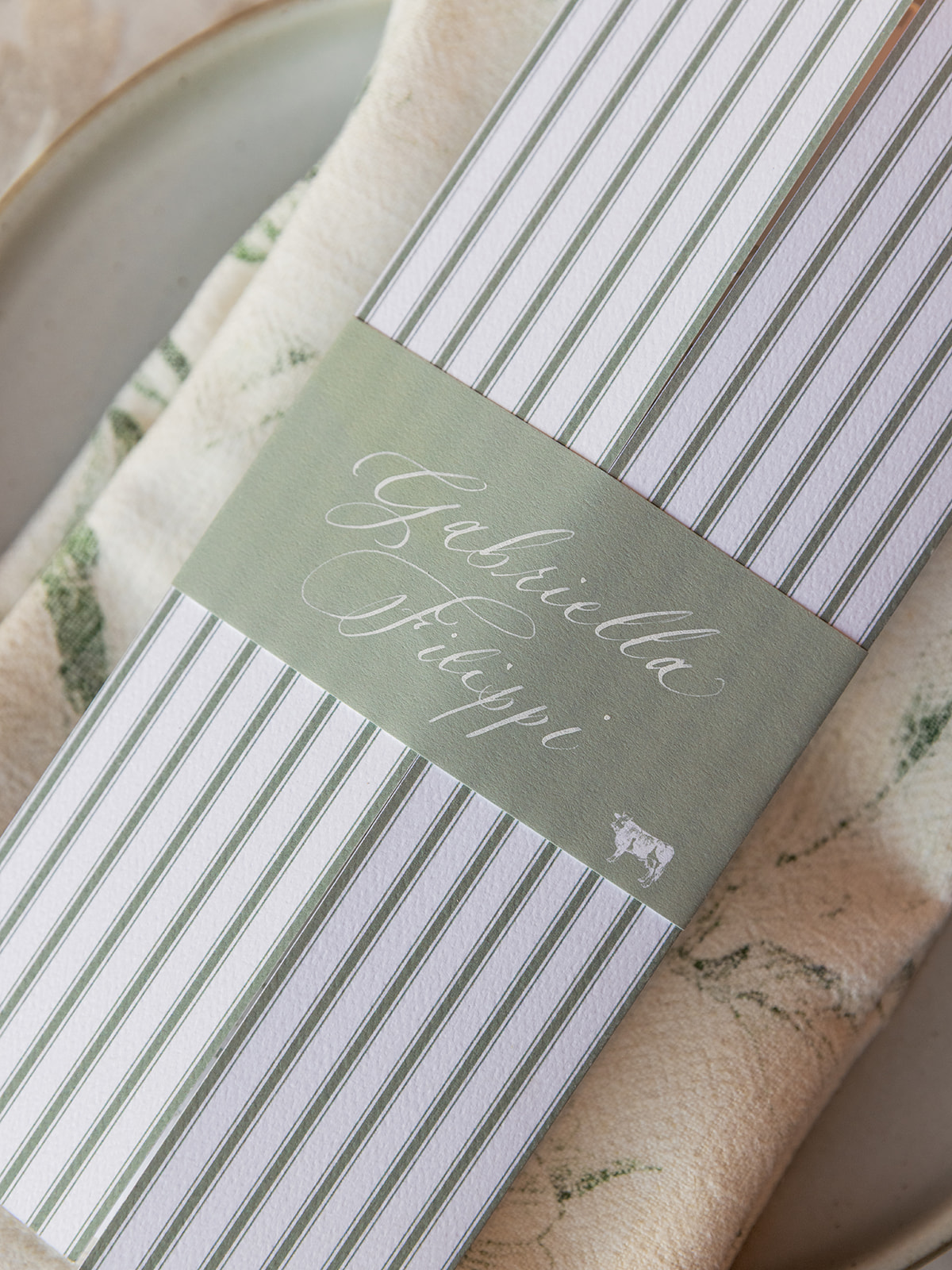 custom gatefold menus with calligraphed place cards wrapped around menu 