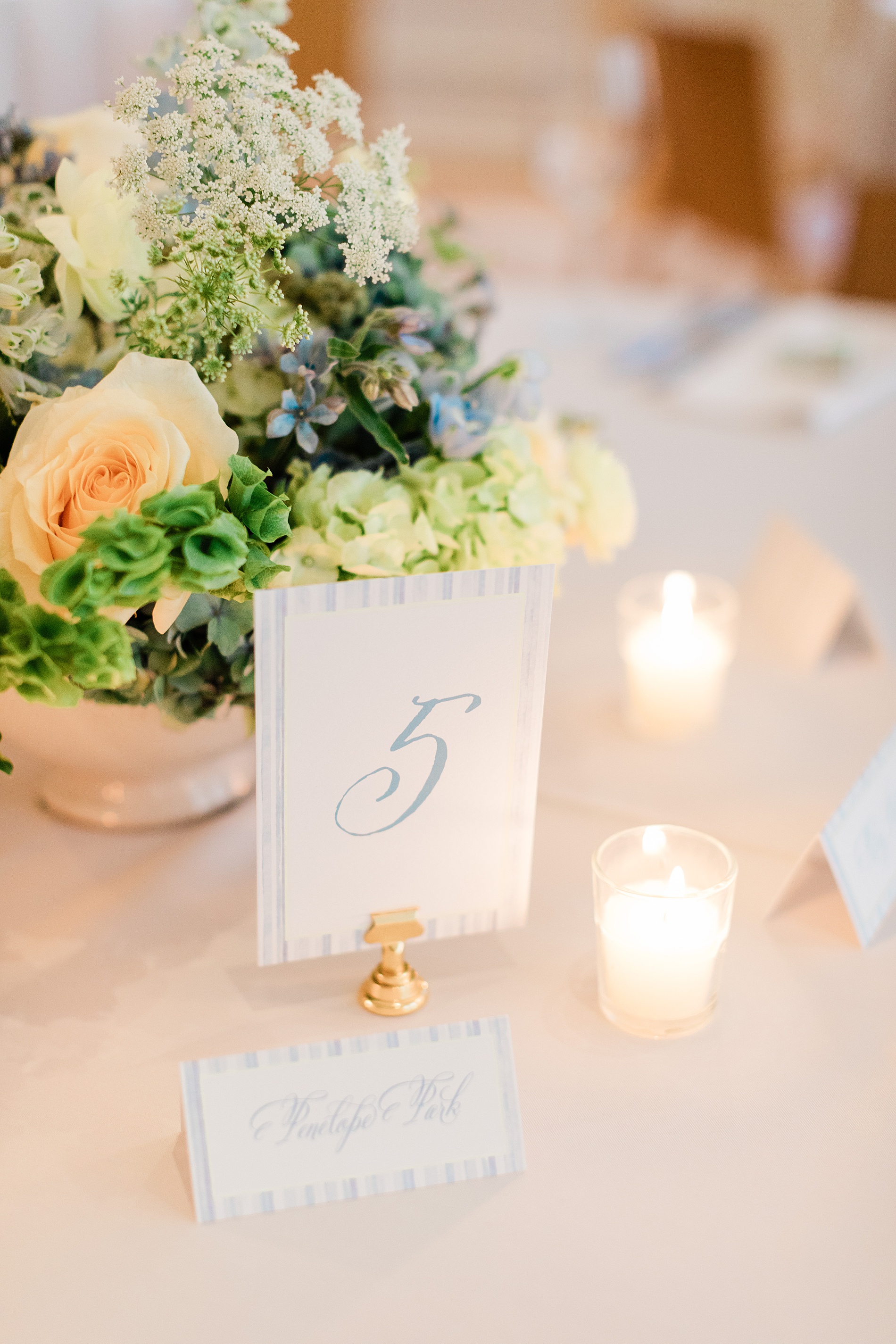 blue and white table numbers and place cards