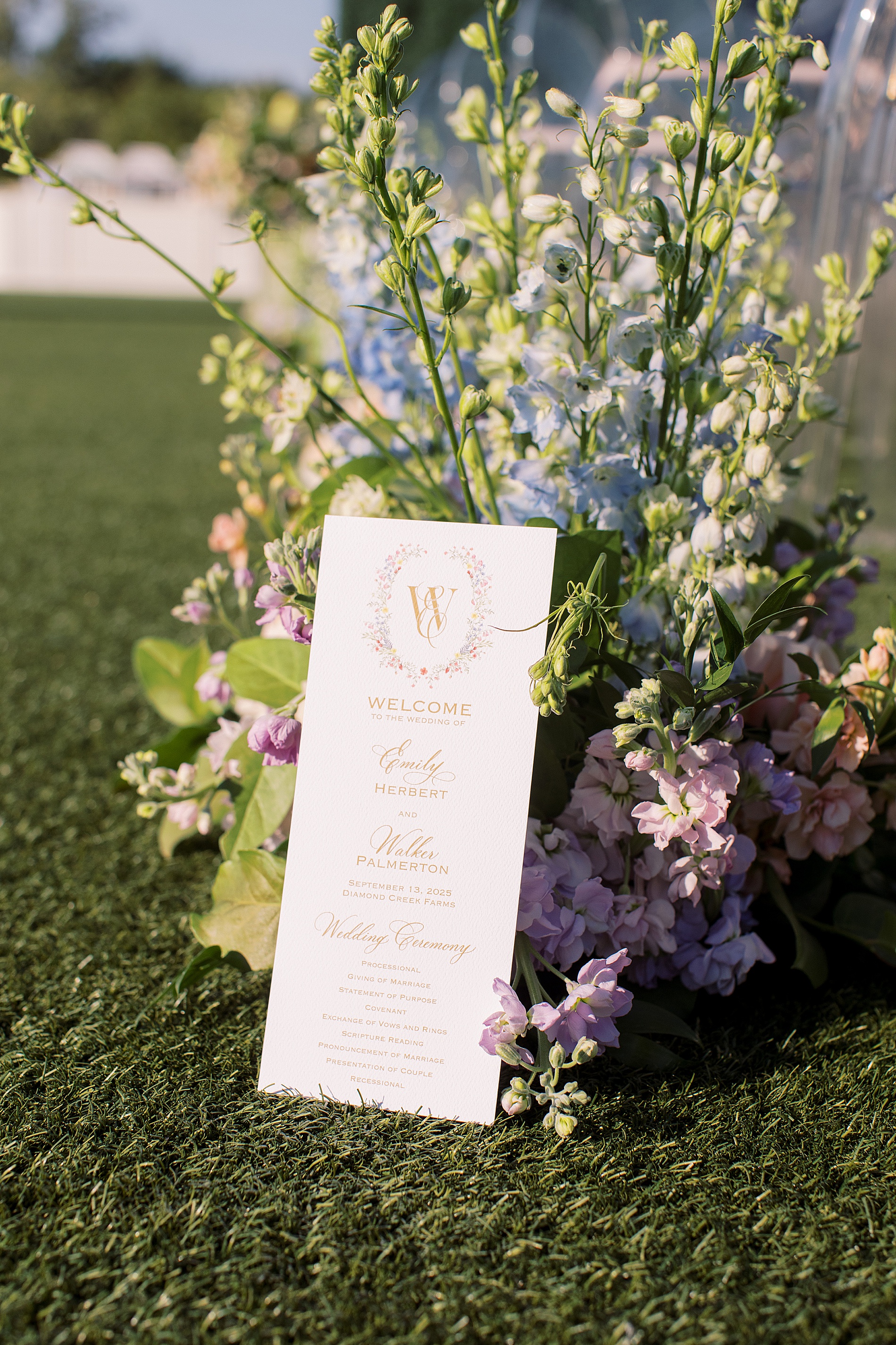 wedding programs featuring floral artwork and monogram 