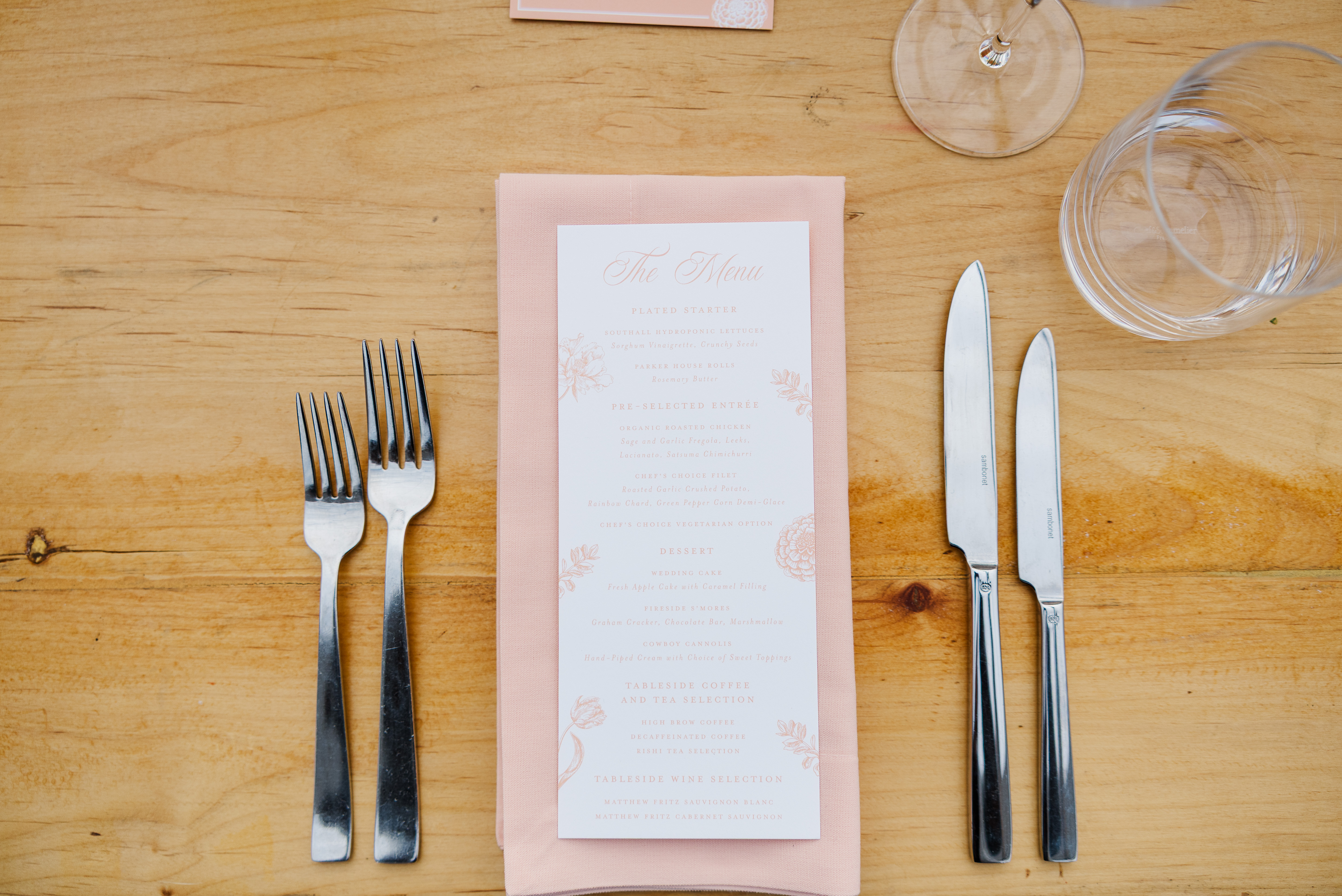 custom wedding menus on light pink napkin 