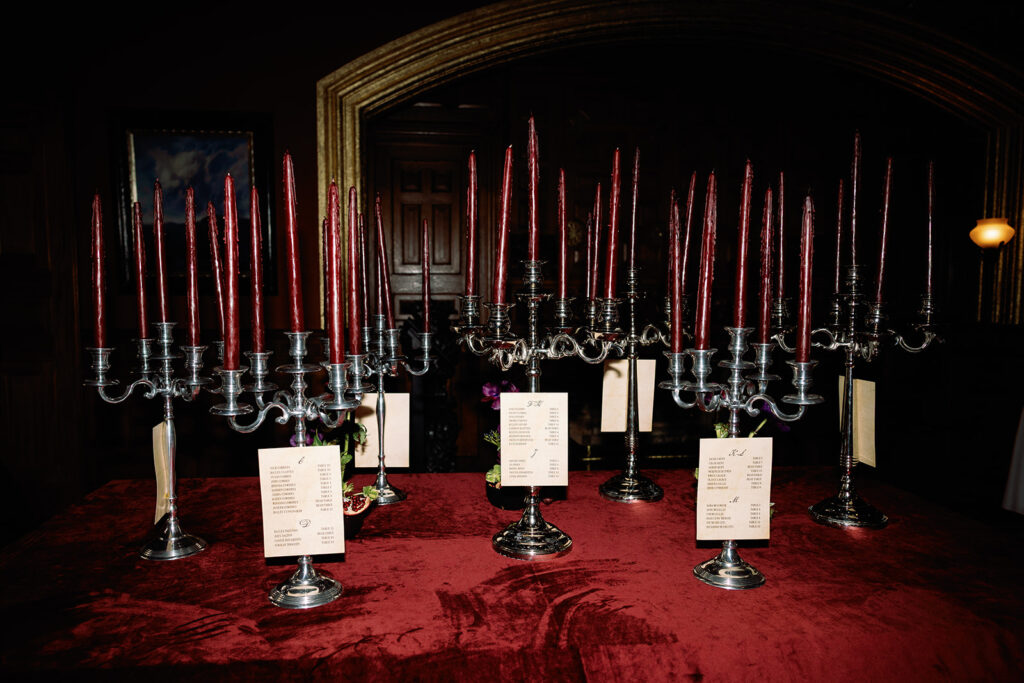custom seating chart with candelabras holding guest cards