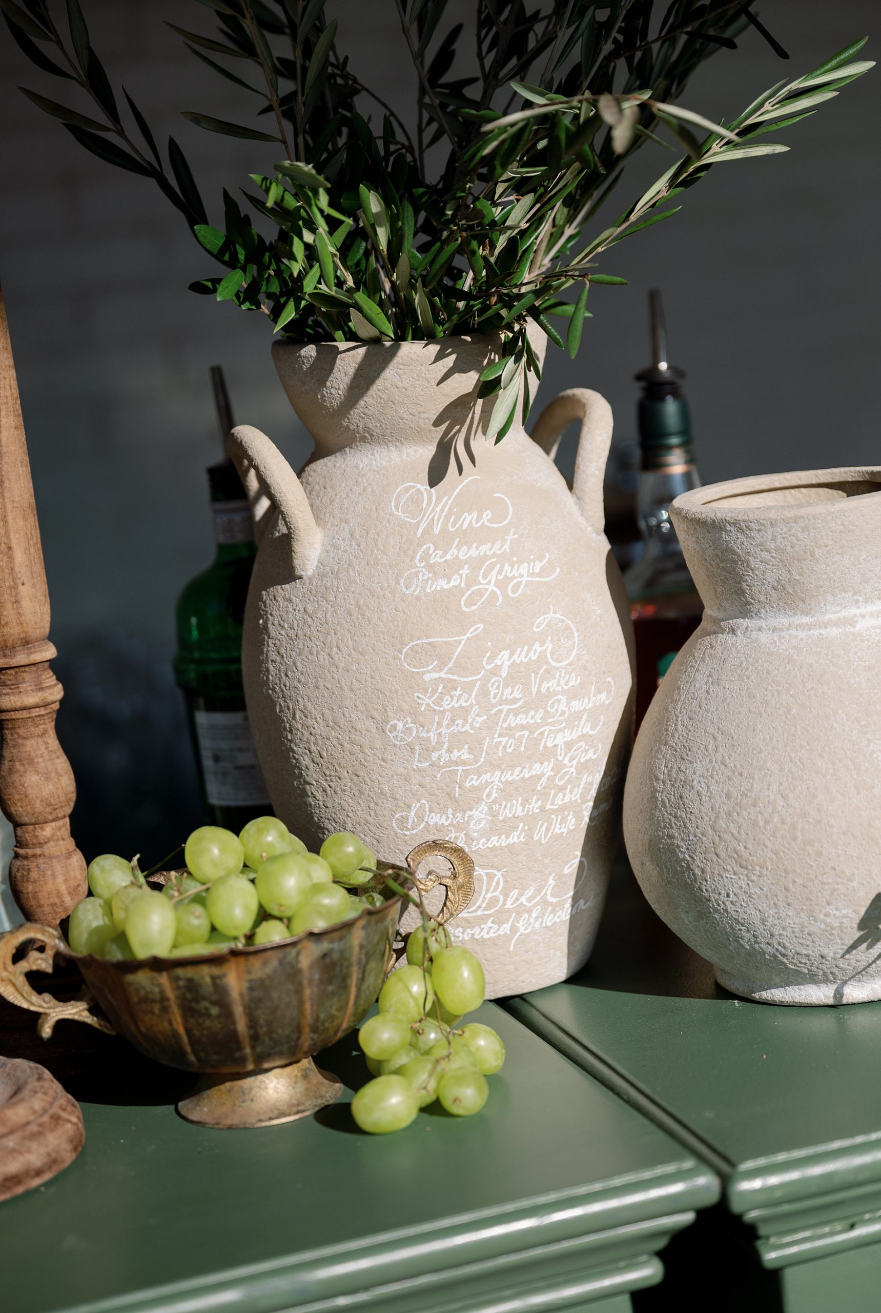 custom bar menu hand lettered on a vase by Nashville wedding design house, White Ink Calligraphy  