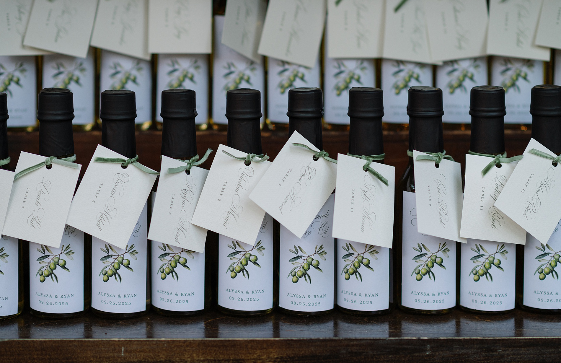 Custom Olive Oil Seating Chart with table assignments on jars
