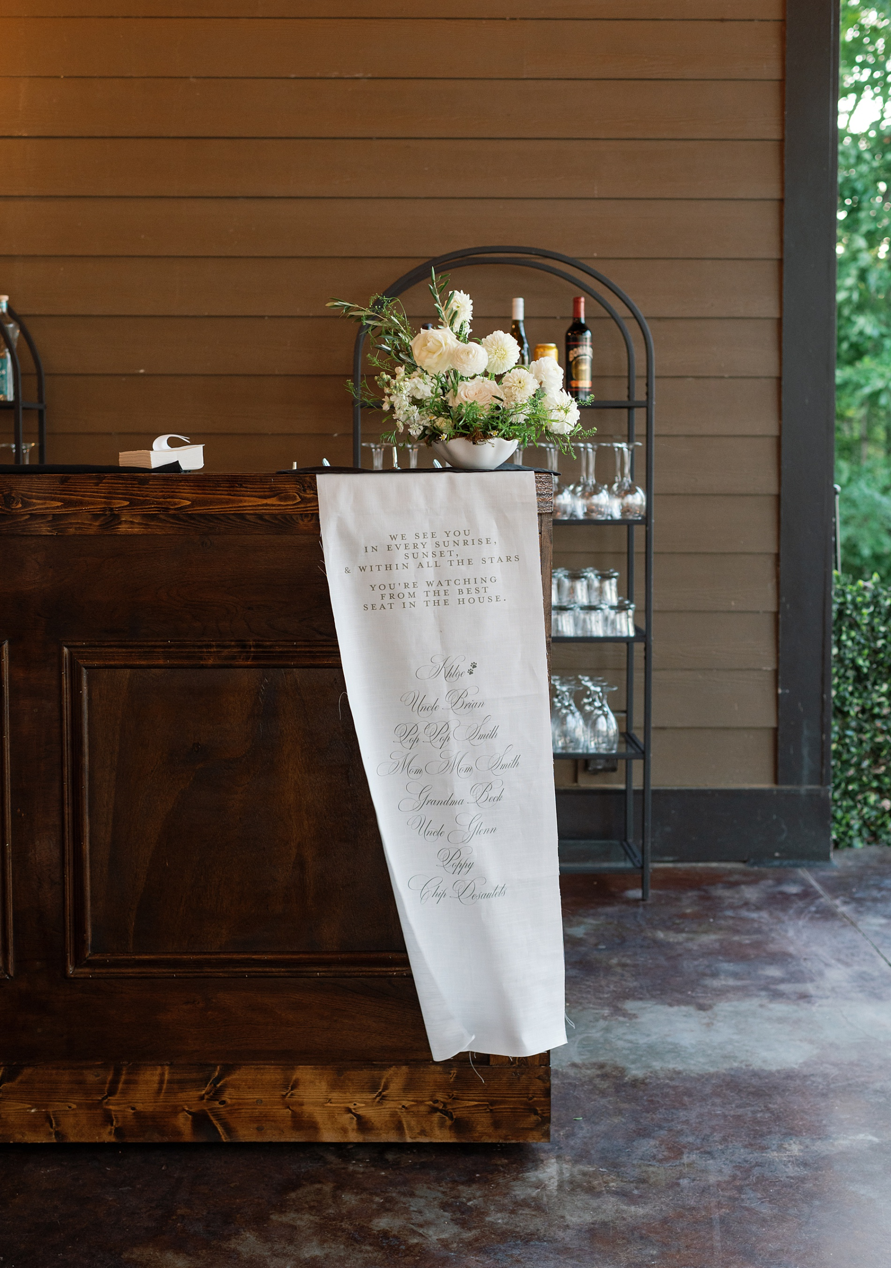 Fabric Memorial sign on wooden bar
