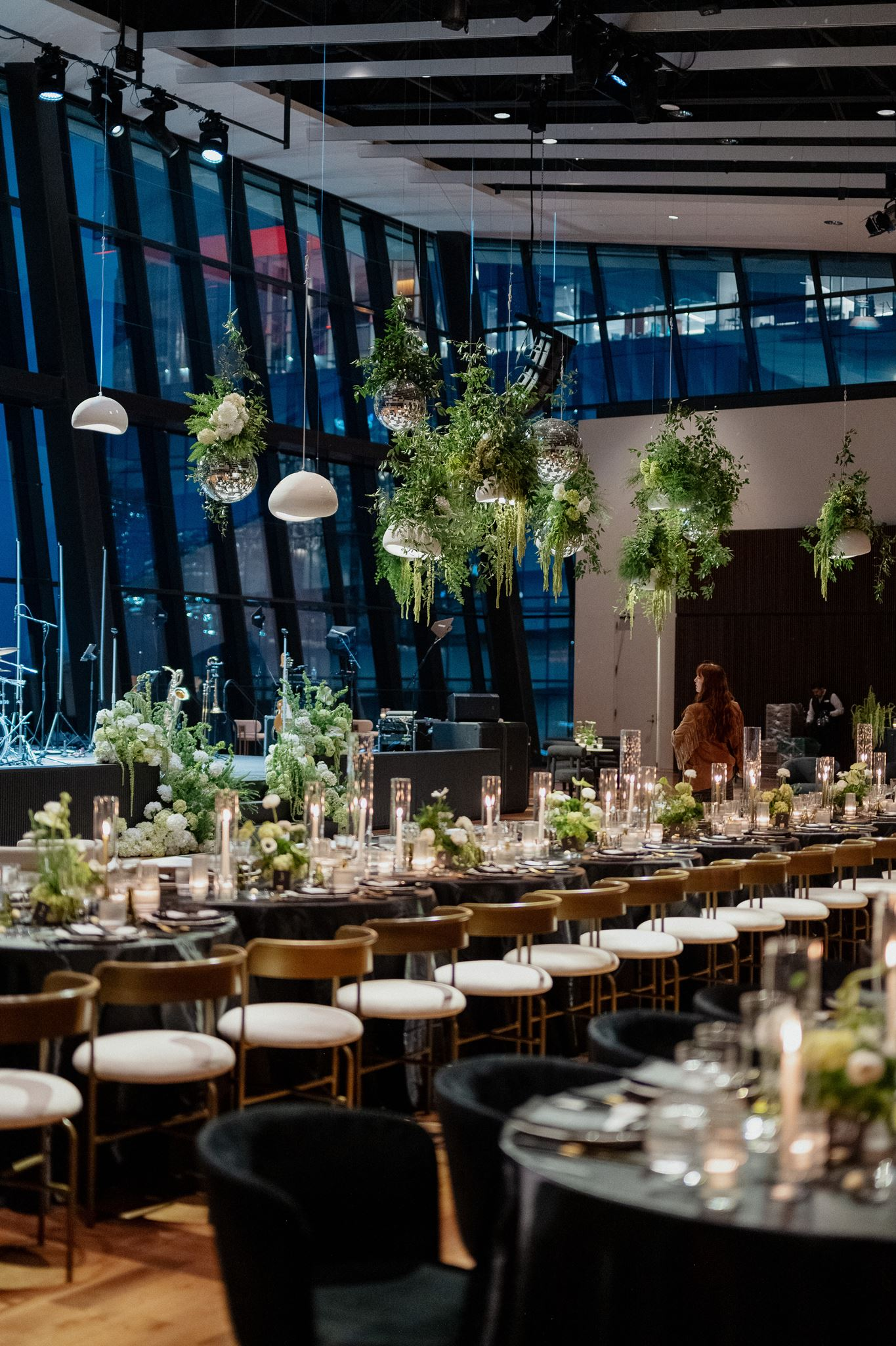 elegant wedding reception with black and white details and greenery 
