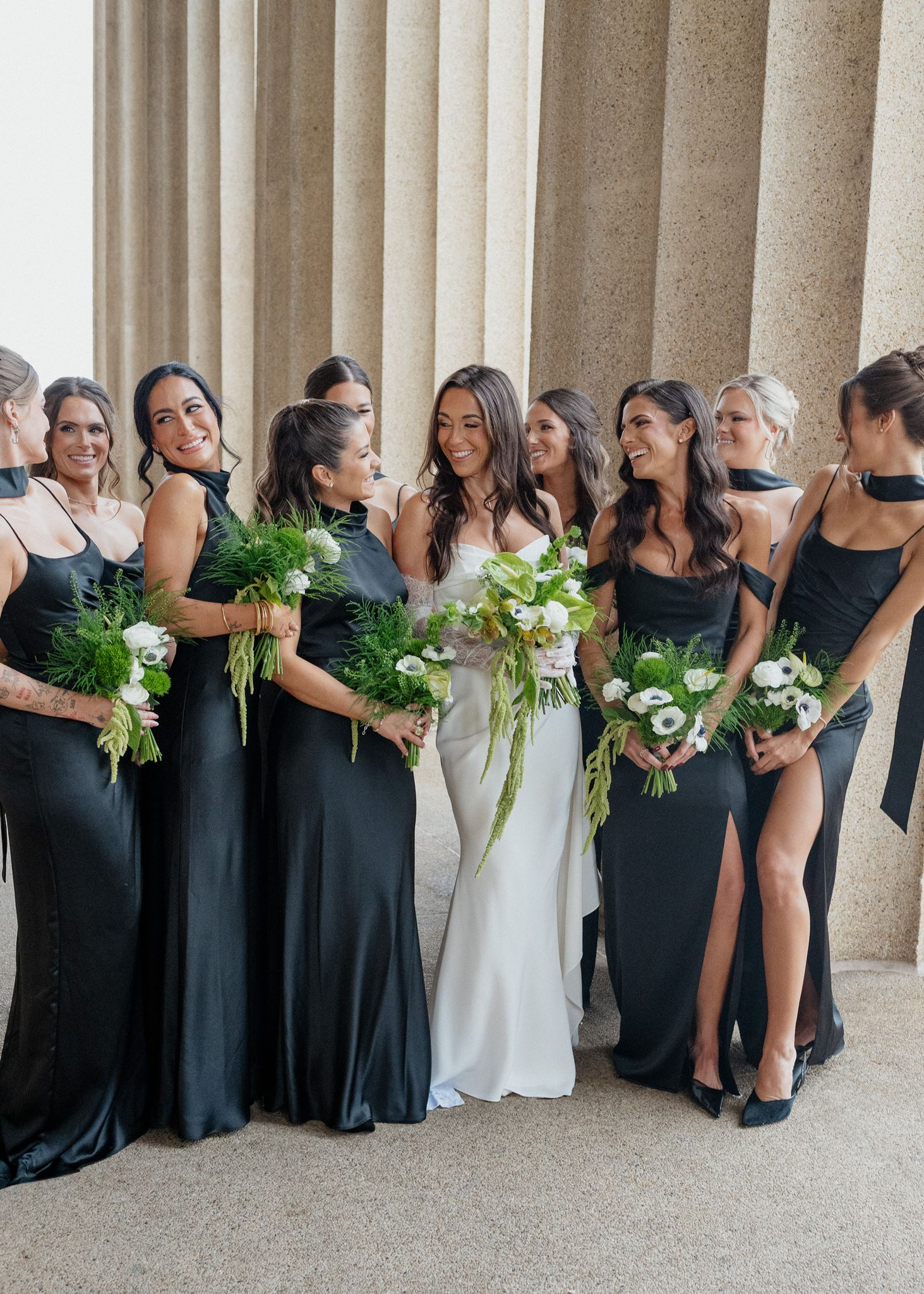 bride with bridesmaids in sleek black bridesmaids dresses before Classic Black and White Wedding at Country Music Hall of Fame