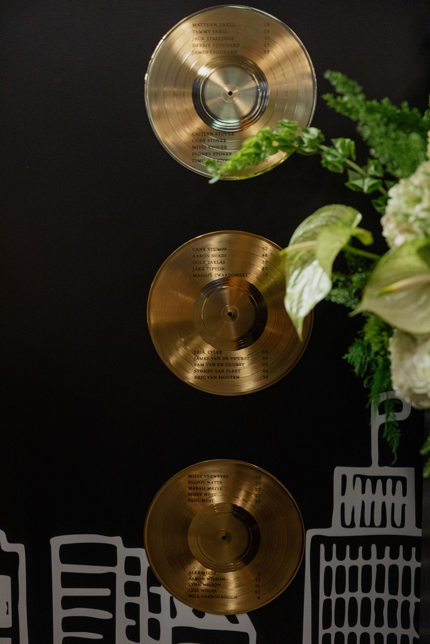 gold vinyl record displaying seating assignments at Music City wedding at Country Music Hall of Fame