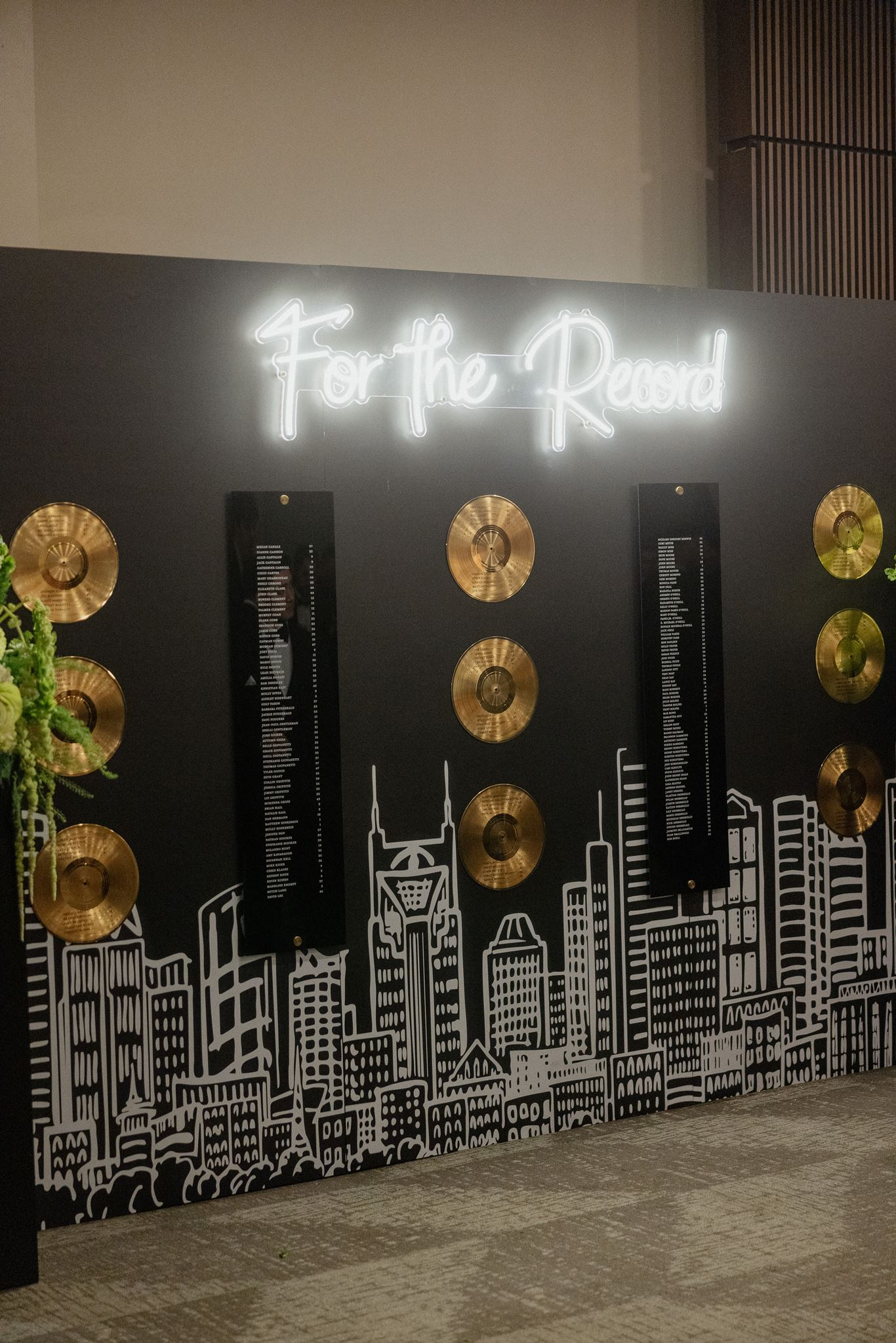 A music city seating chart featuring  Nashville skyline and gold vinyl records displaying seating arrangements  