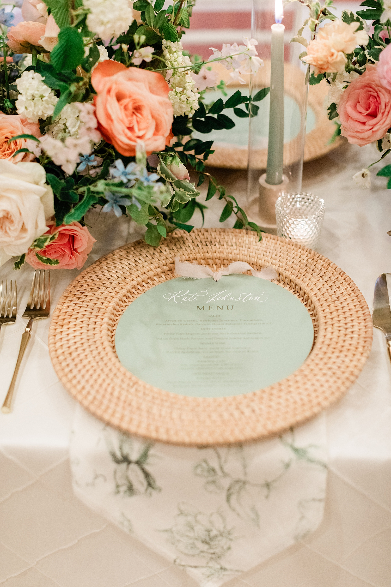 circular green menus with guest names written in calligraphy directly on menu