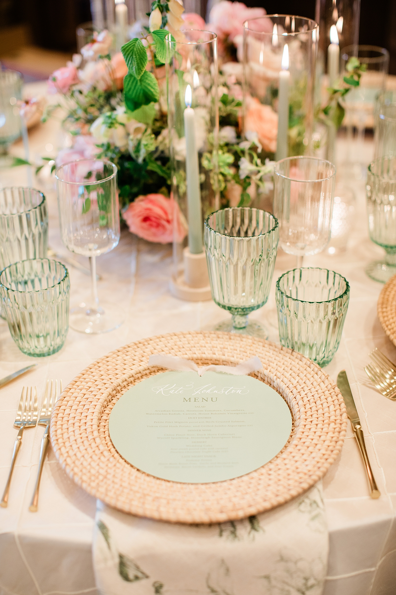 circular green menus with guest names written in calligraphy directly on menu