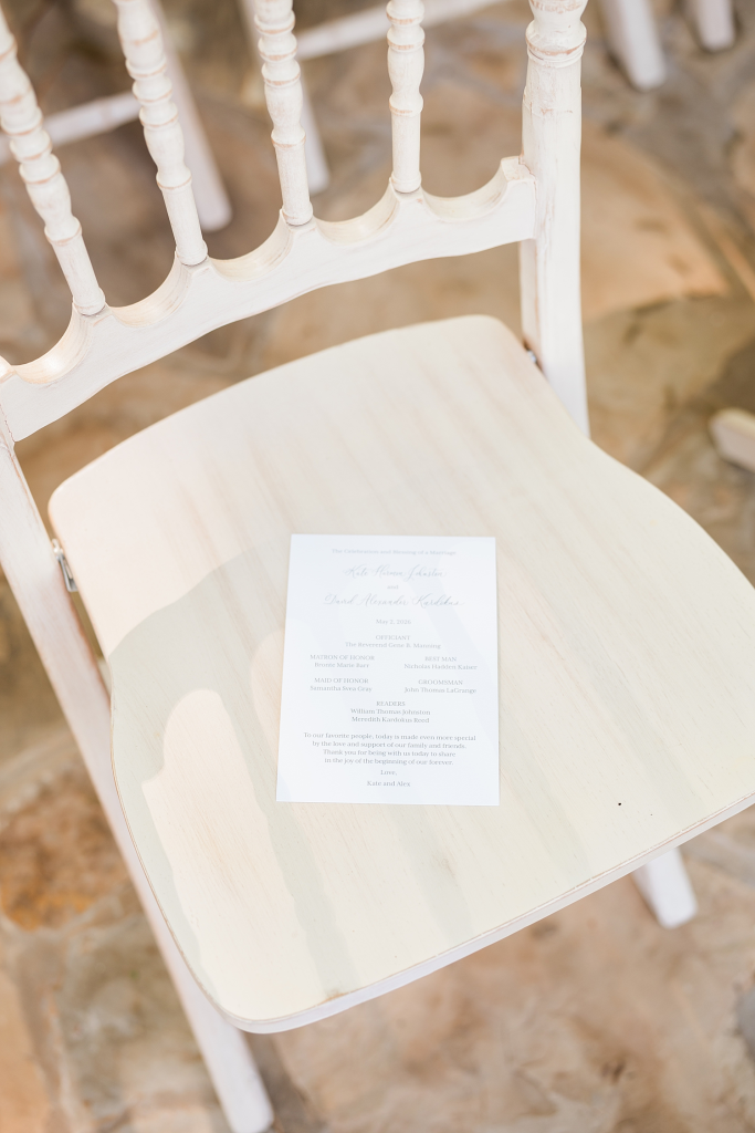 wedding programs on chair at reception