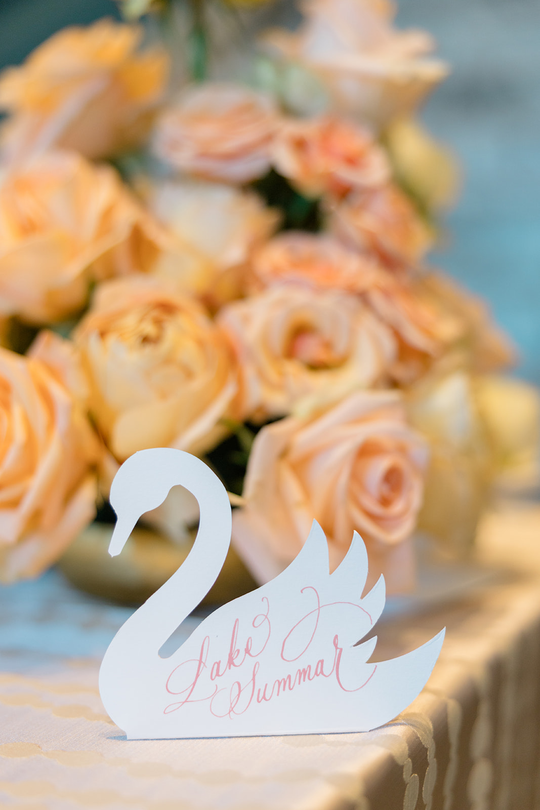die-cut swan escort cards with pink calligraphy for Wed Society Nashville Book of Weddings Event with Marble Artwork and Swan Details