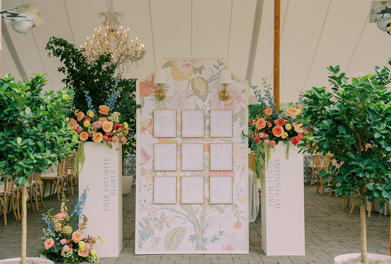 elegant seating chart decorated with flowers and background that ties to invitation suite