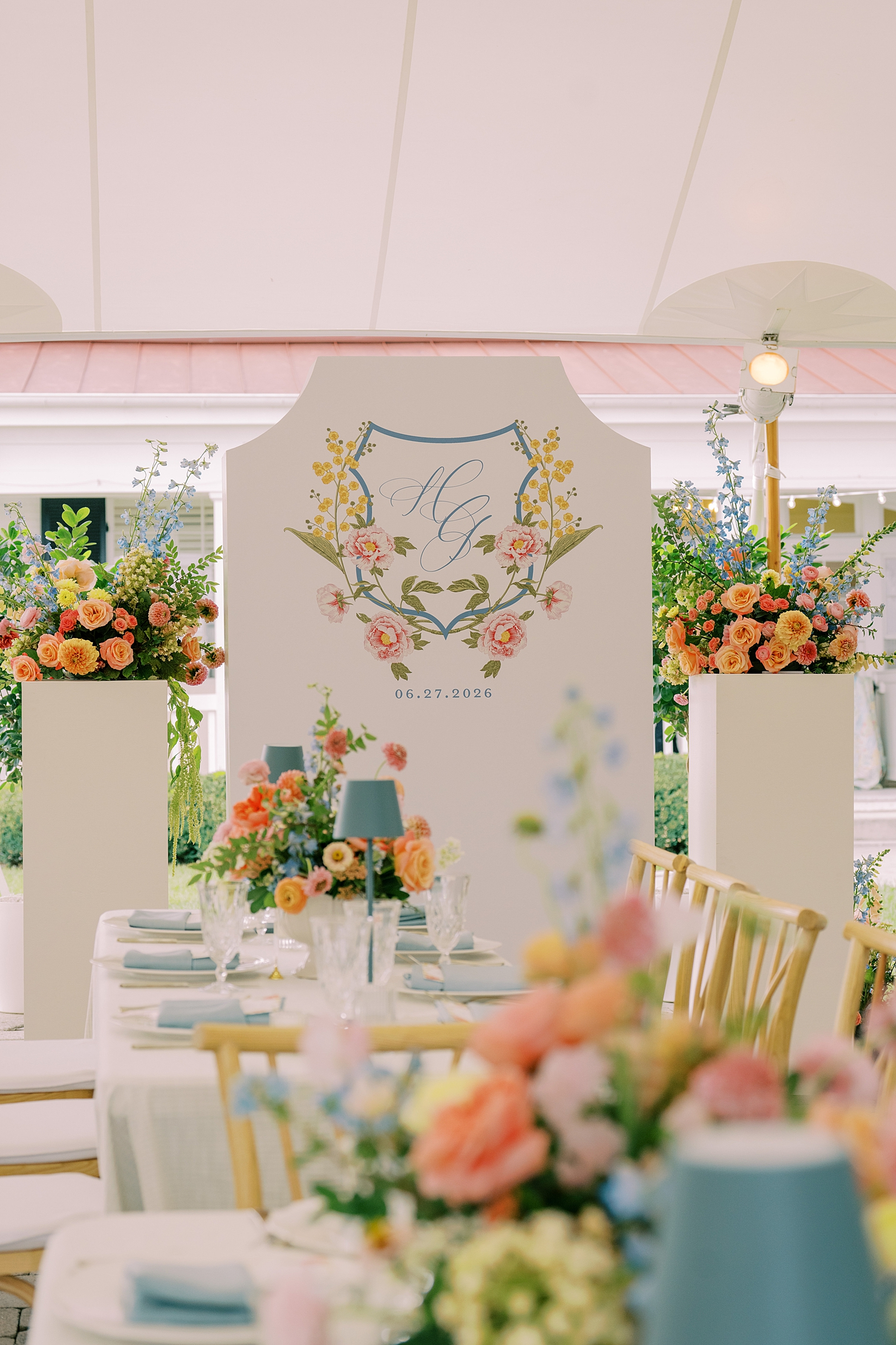 couple's custom crest and monogram on back of seating chart facing reception area